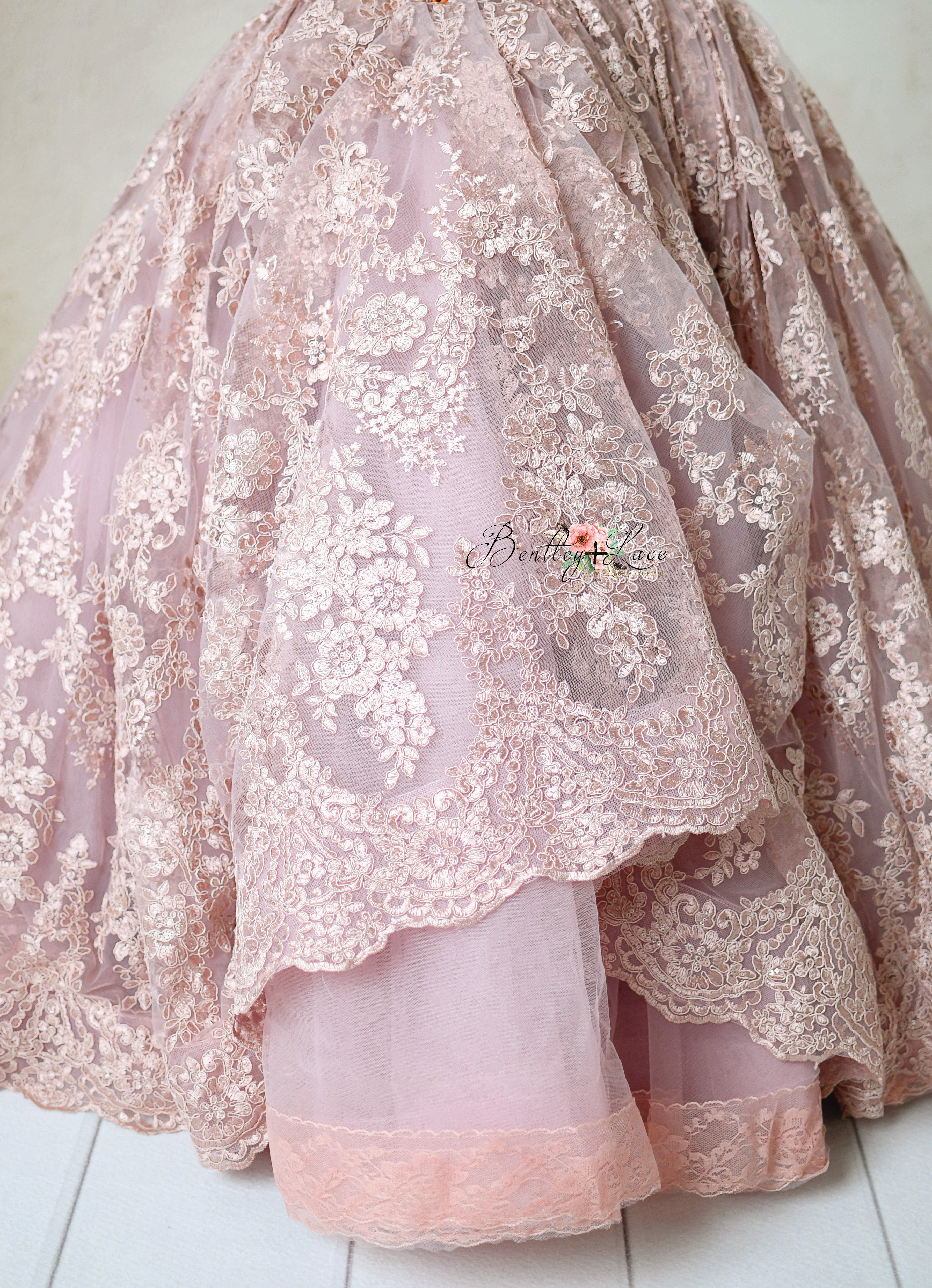 Whimsical lace dress with shimmering details, perfect for photoshoots and special occasions.