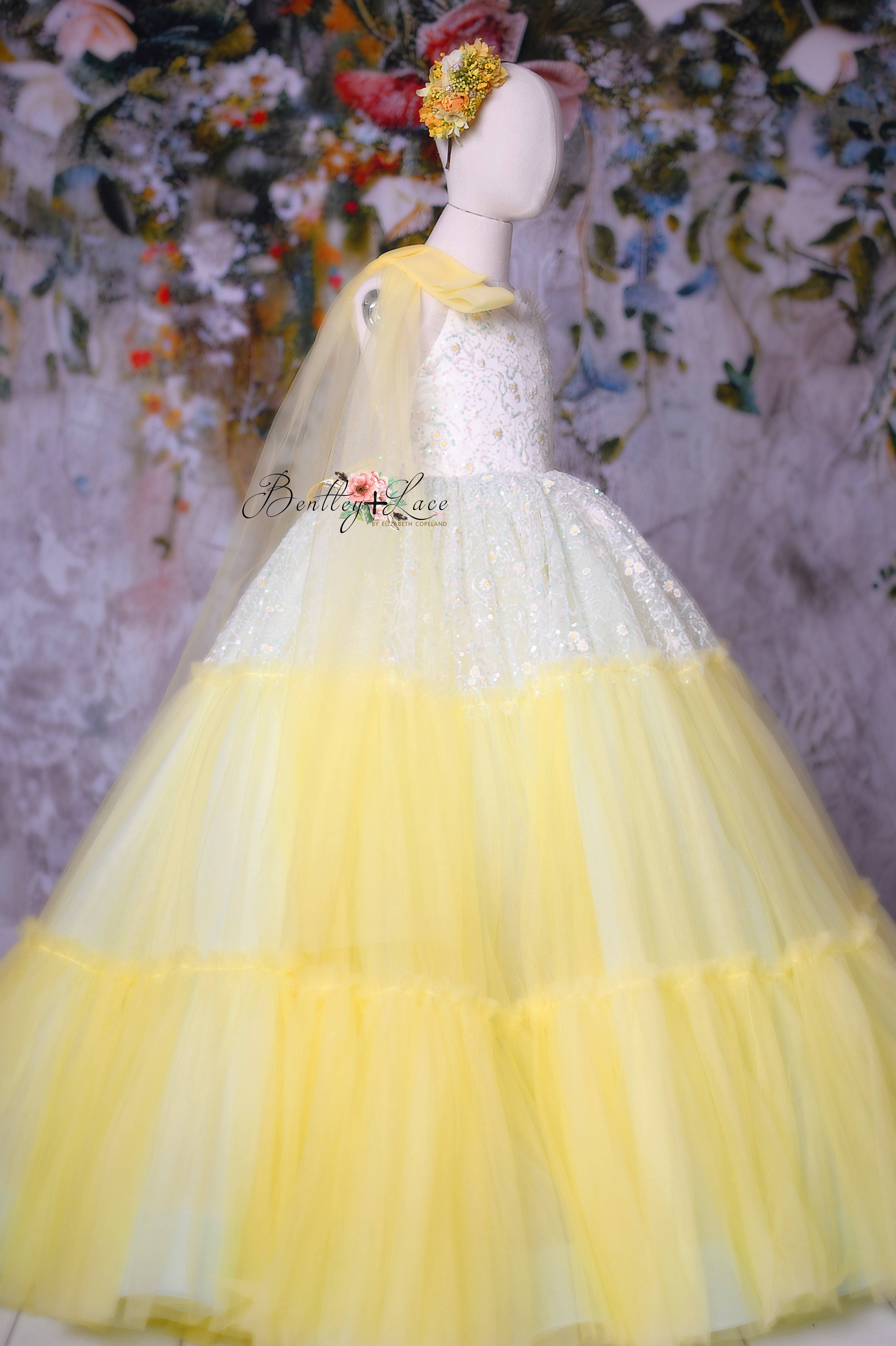 The "Harmony" Daisy Gown featuring a voluminous ombré tulle skirt and delicate shoulder ties.