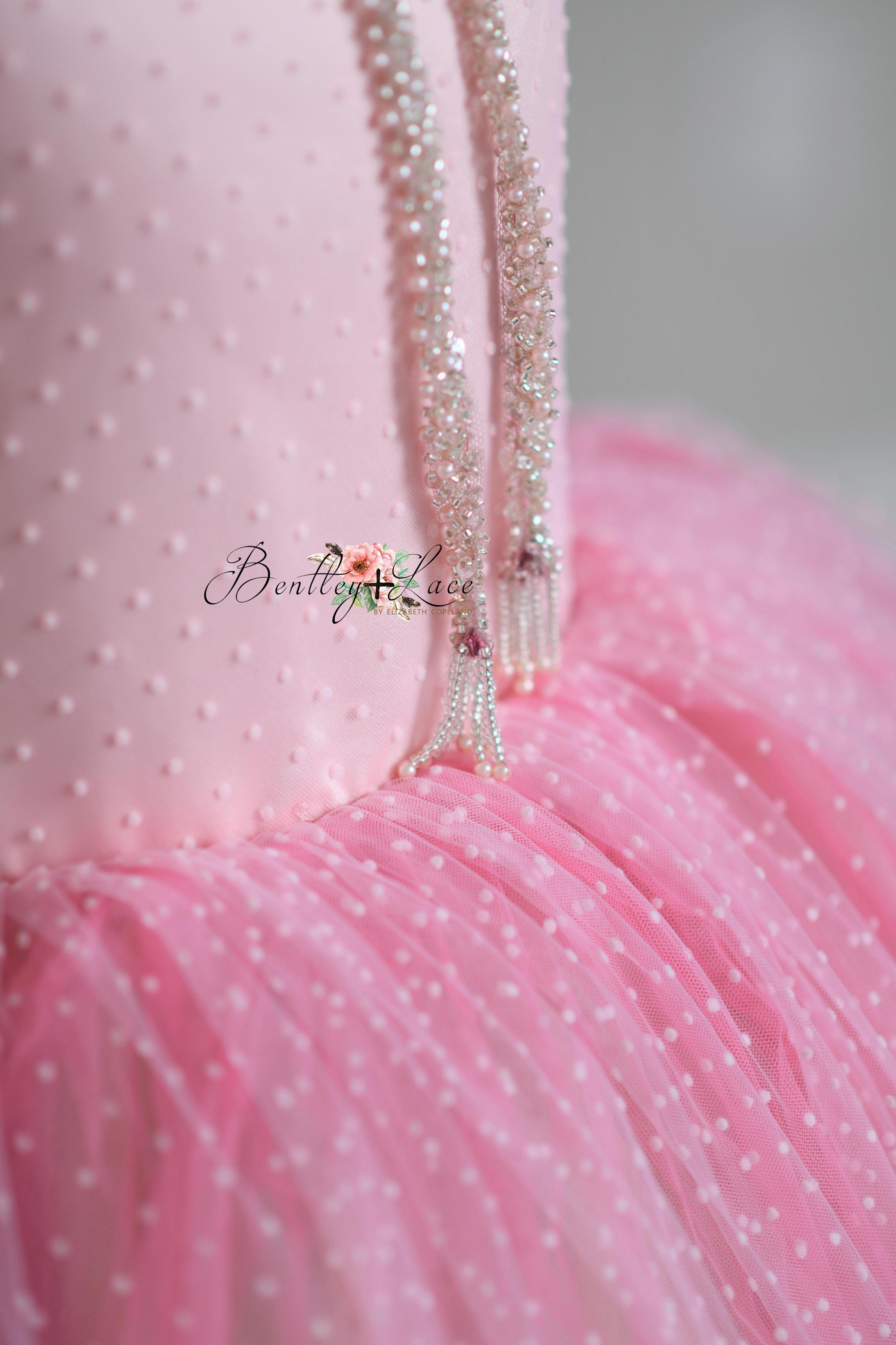 "Full-length shot of the Swish Dot Couture gown flowing with layers of pastel tulle, perfect for elegant photography sessions."