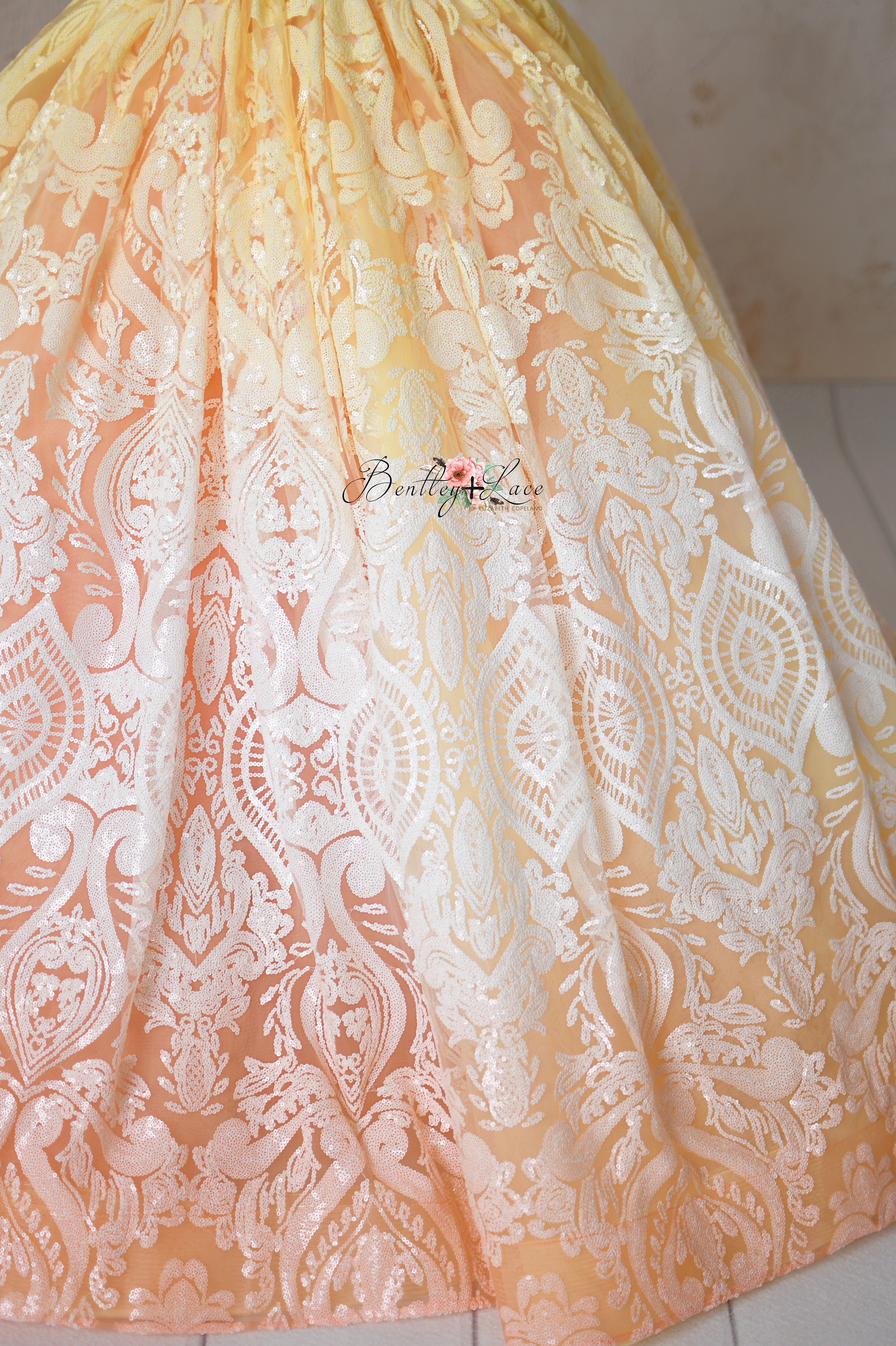Full-length view of the "Sugar Kisses" gown showcasing its flowing silhouette.
