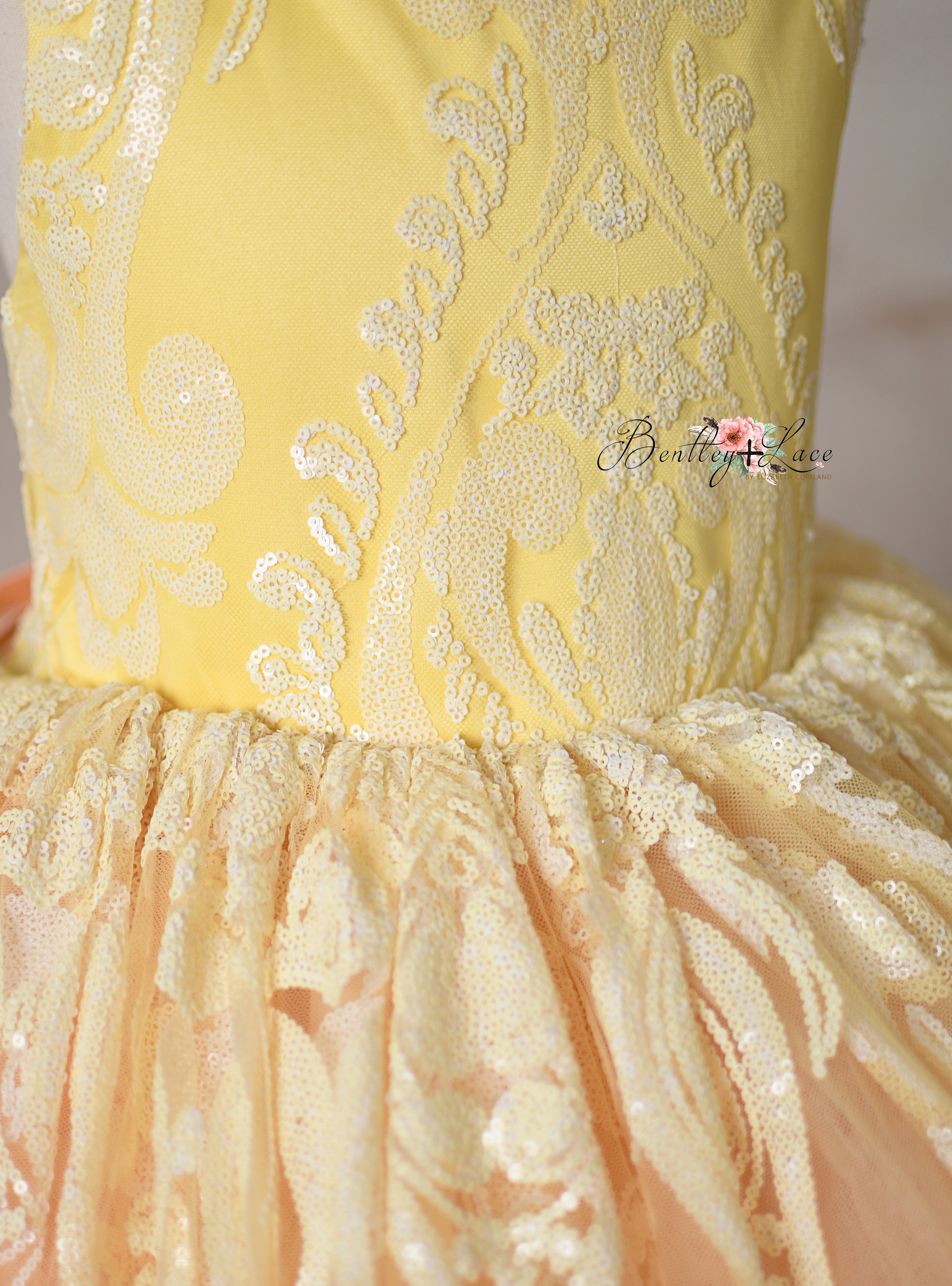 Side angle of the "Sugar Kisses" dress highlighting its luxurious fabric.