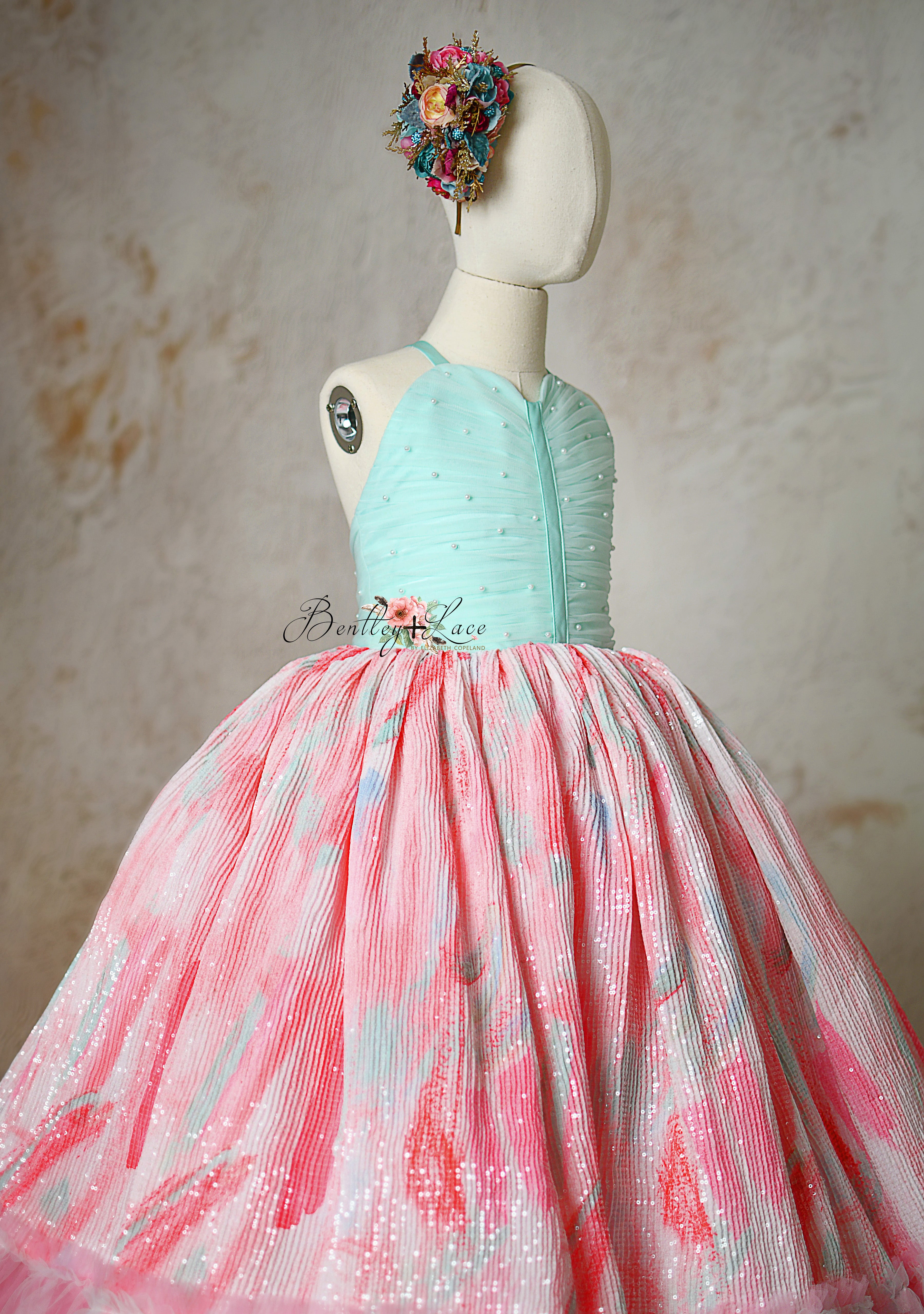 Soft pastel Cotton Candy Dream gown with a matching floral headpiece.