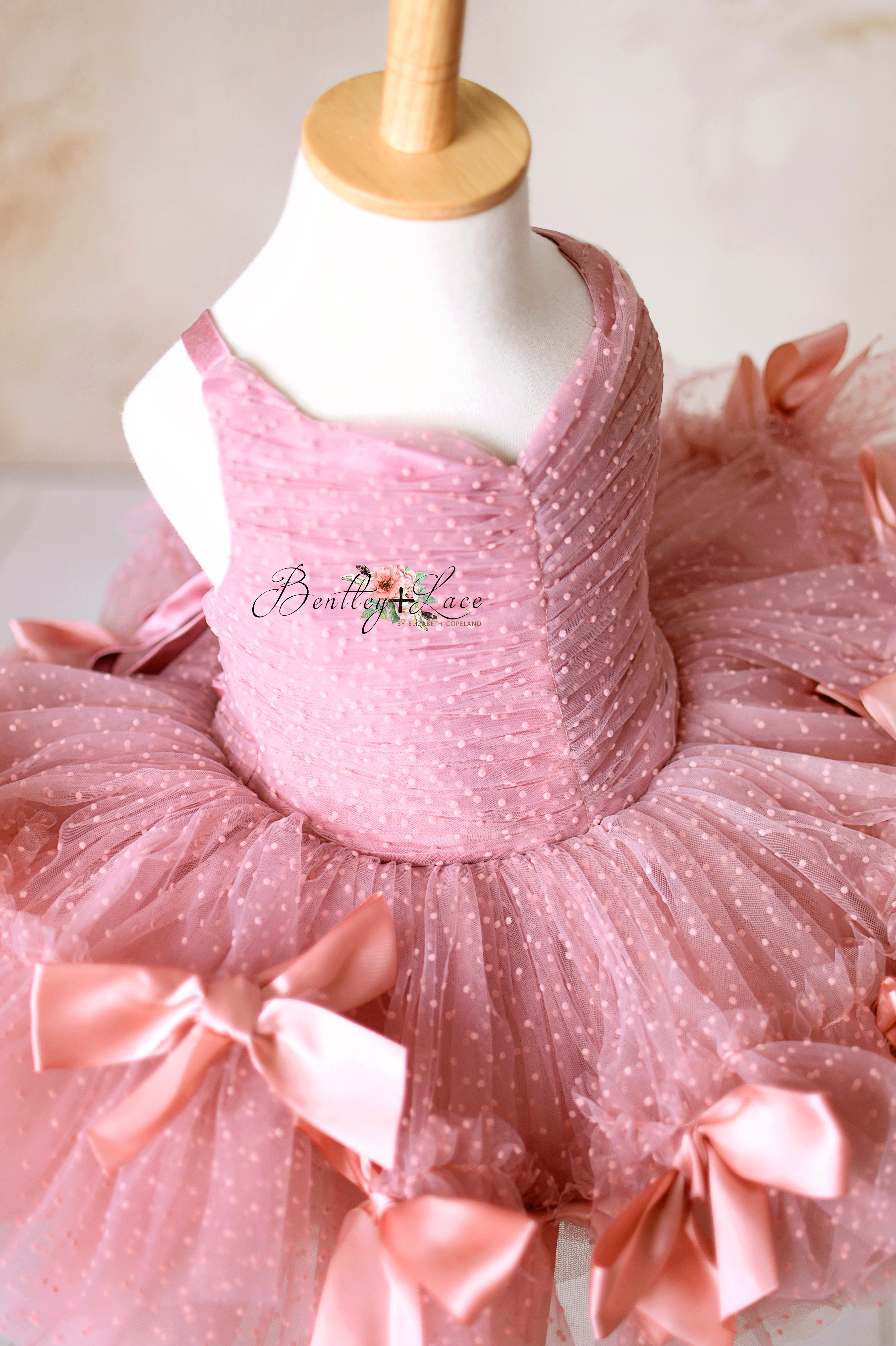 Beautifully detailed toddler tutu dress with soft layers of dotted mesh and silky ribbons.