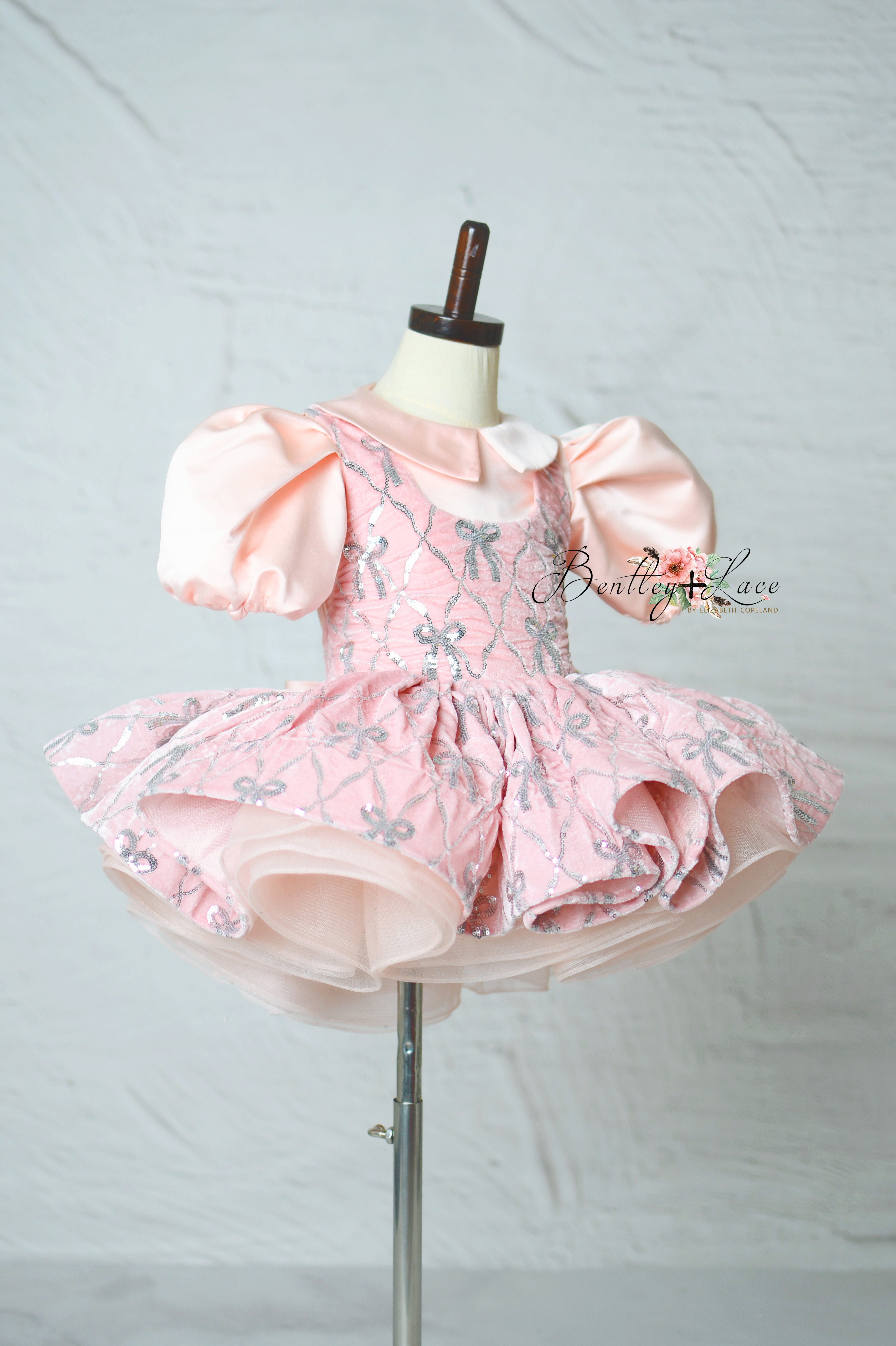 "Pink velvet couture girls dress with silver embroidered bows"
