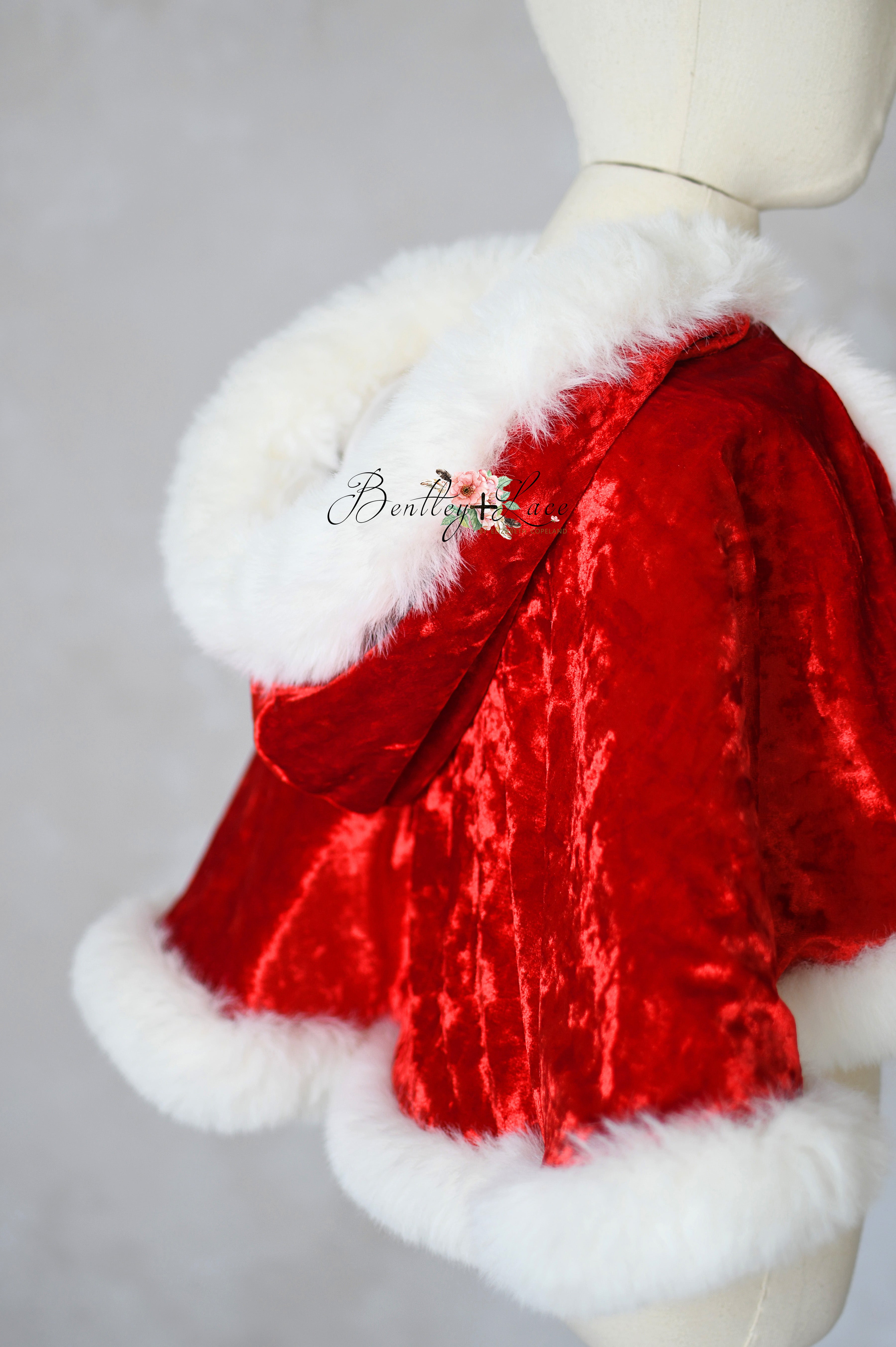 Side shot of faux fur trim and velvet c cape