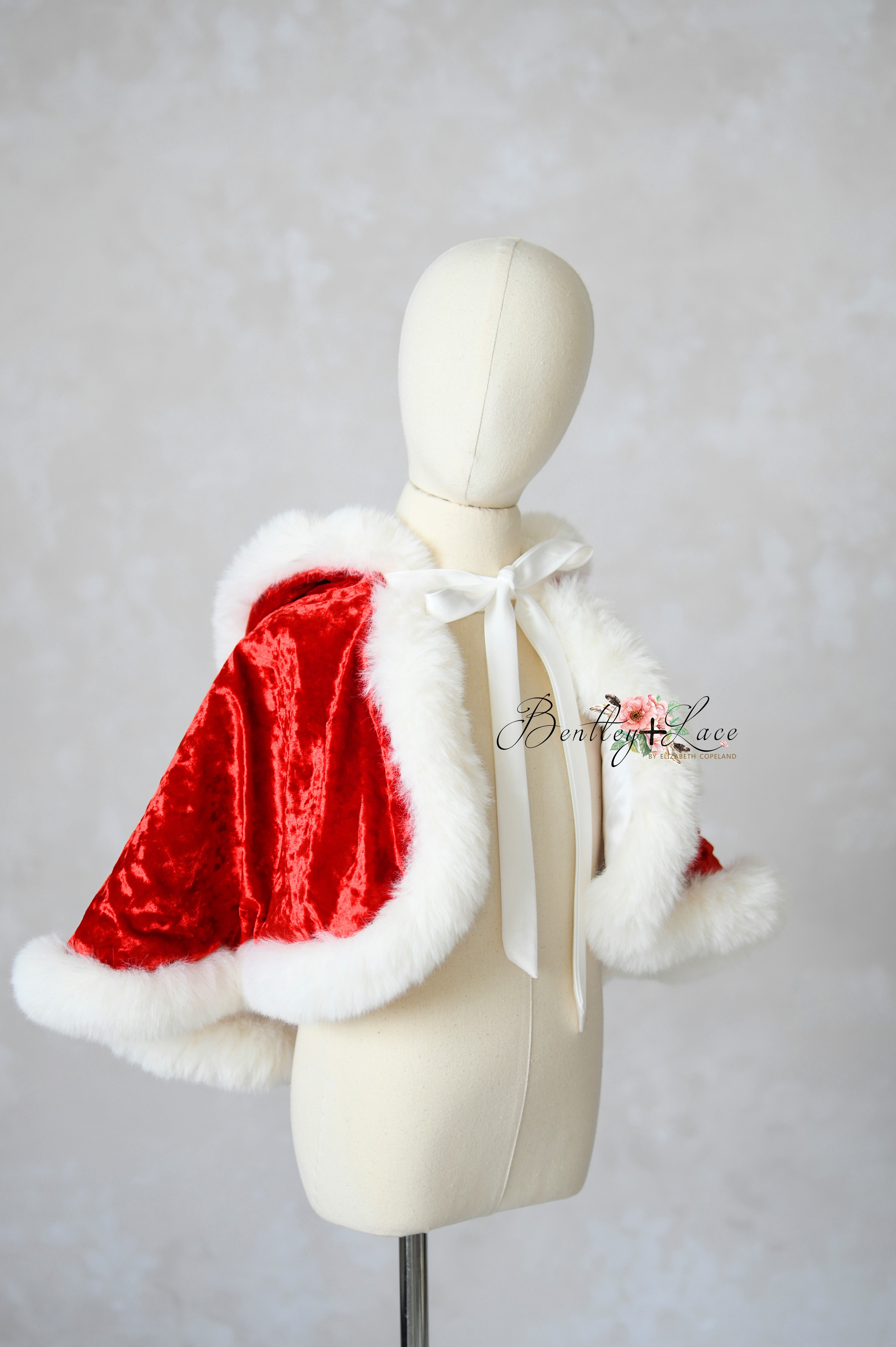 Detailed shot of faux fur trim and velvet fabric on holiday cape