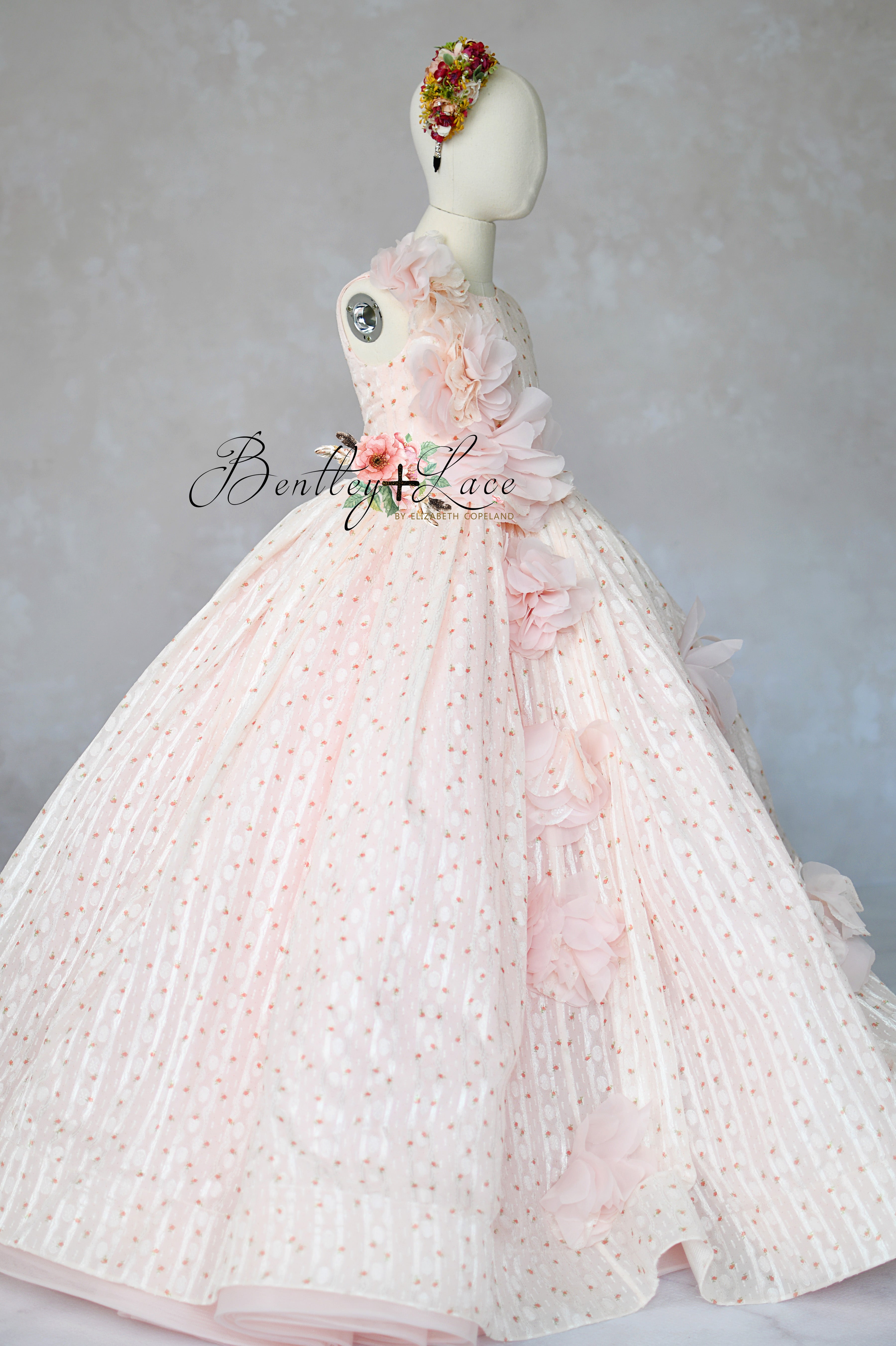 "Blush pink couture girls gown with 3D floral appliqués and full skirt"