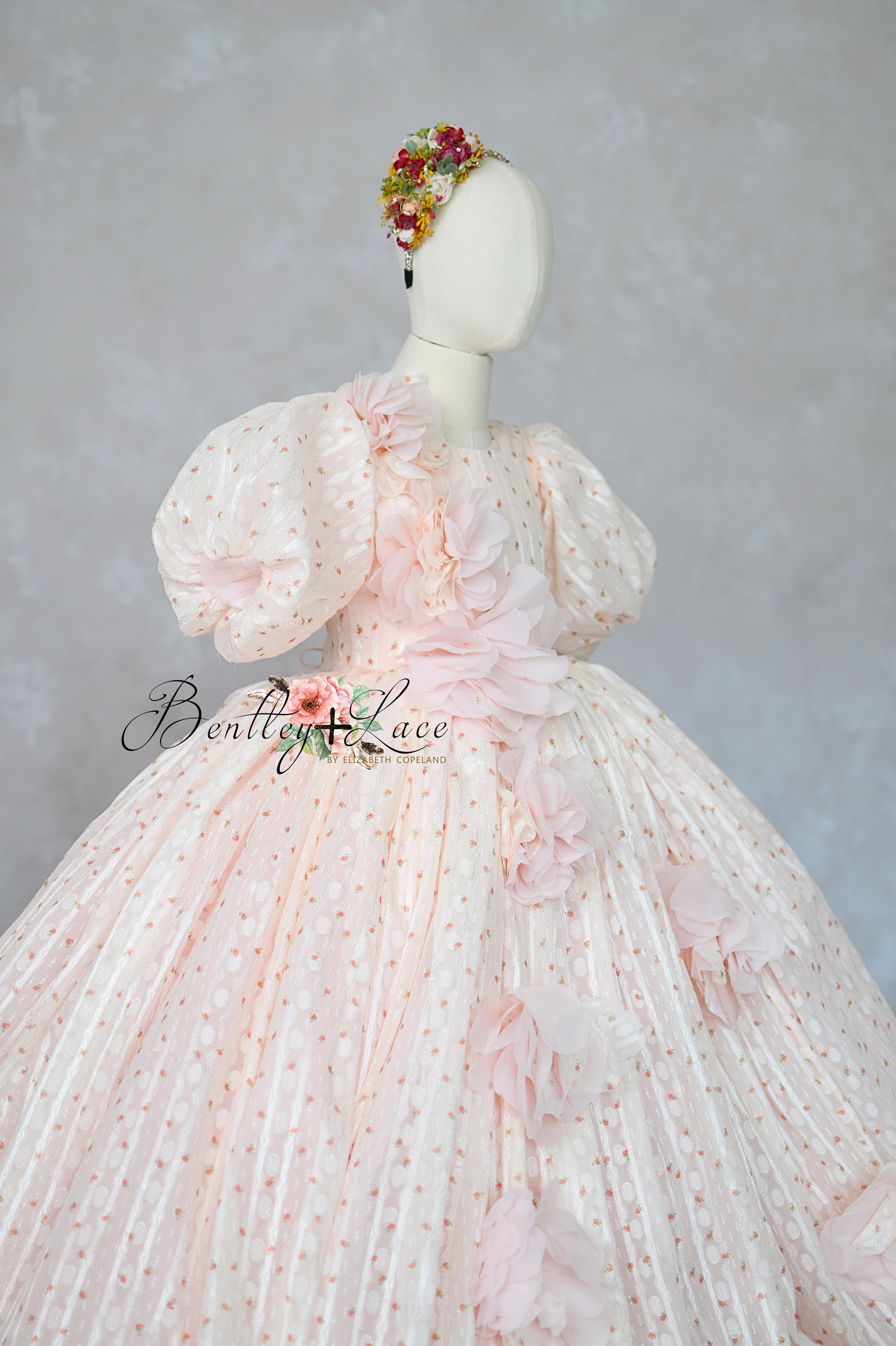 "Blush pink couture girls gown with 3D floral appliqués and full skirt"