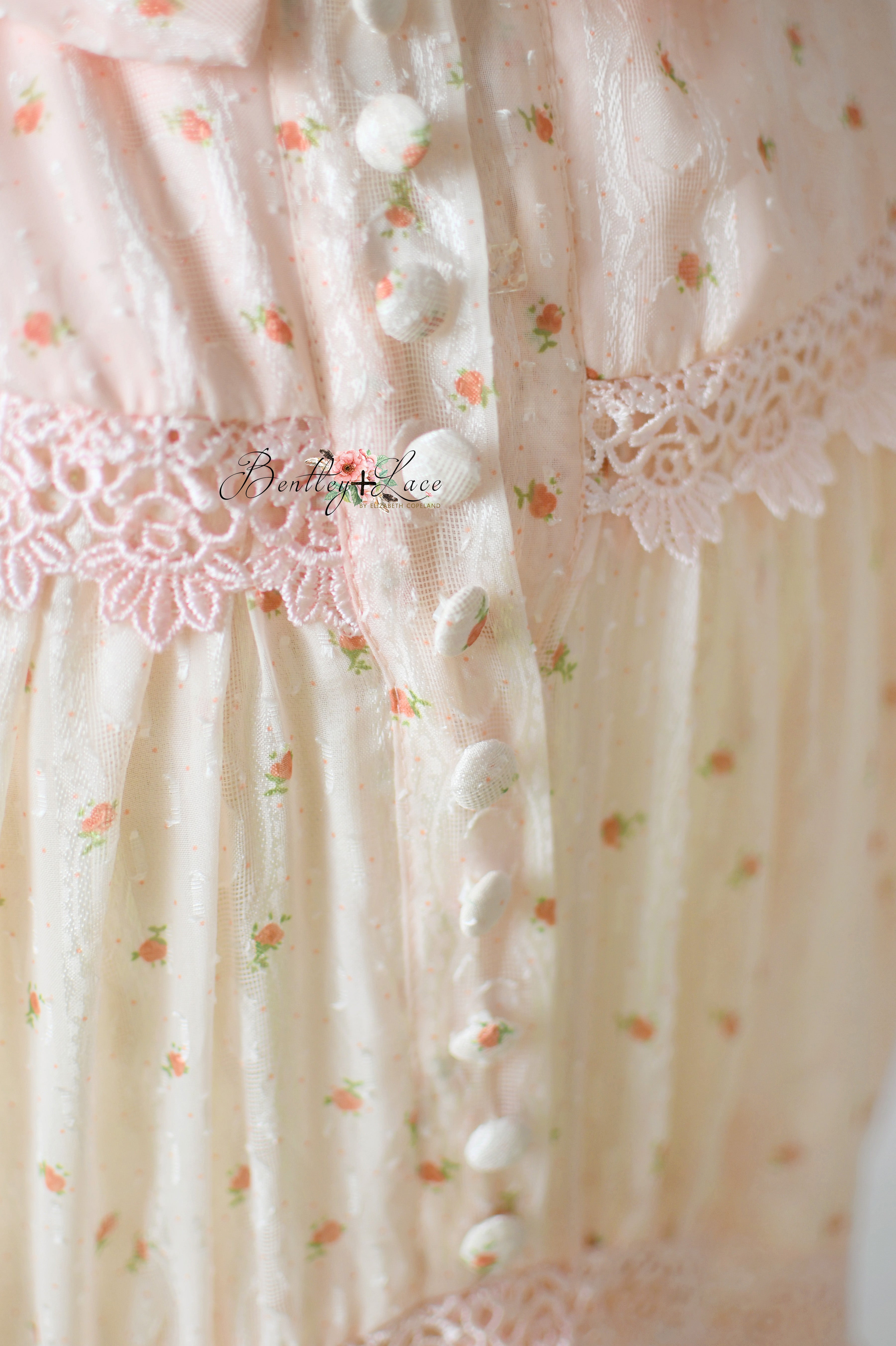 Sugar Rosette gown hanging on a vintage wooden hanger