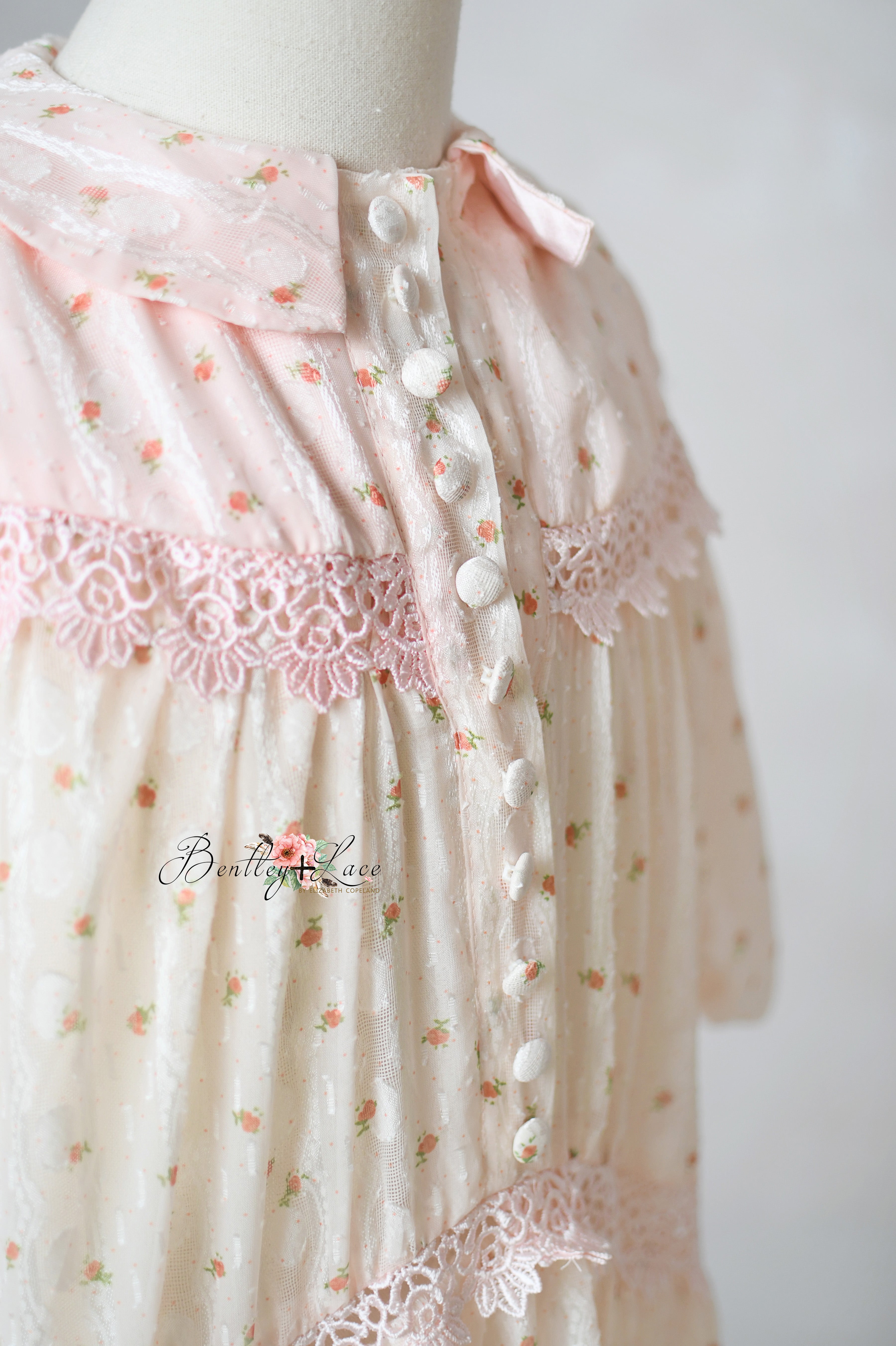 Detail shot of rosette and lace fabric textures on gown skirt