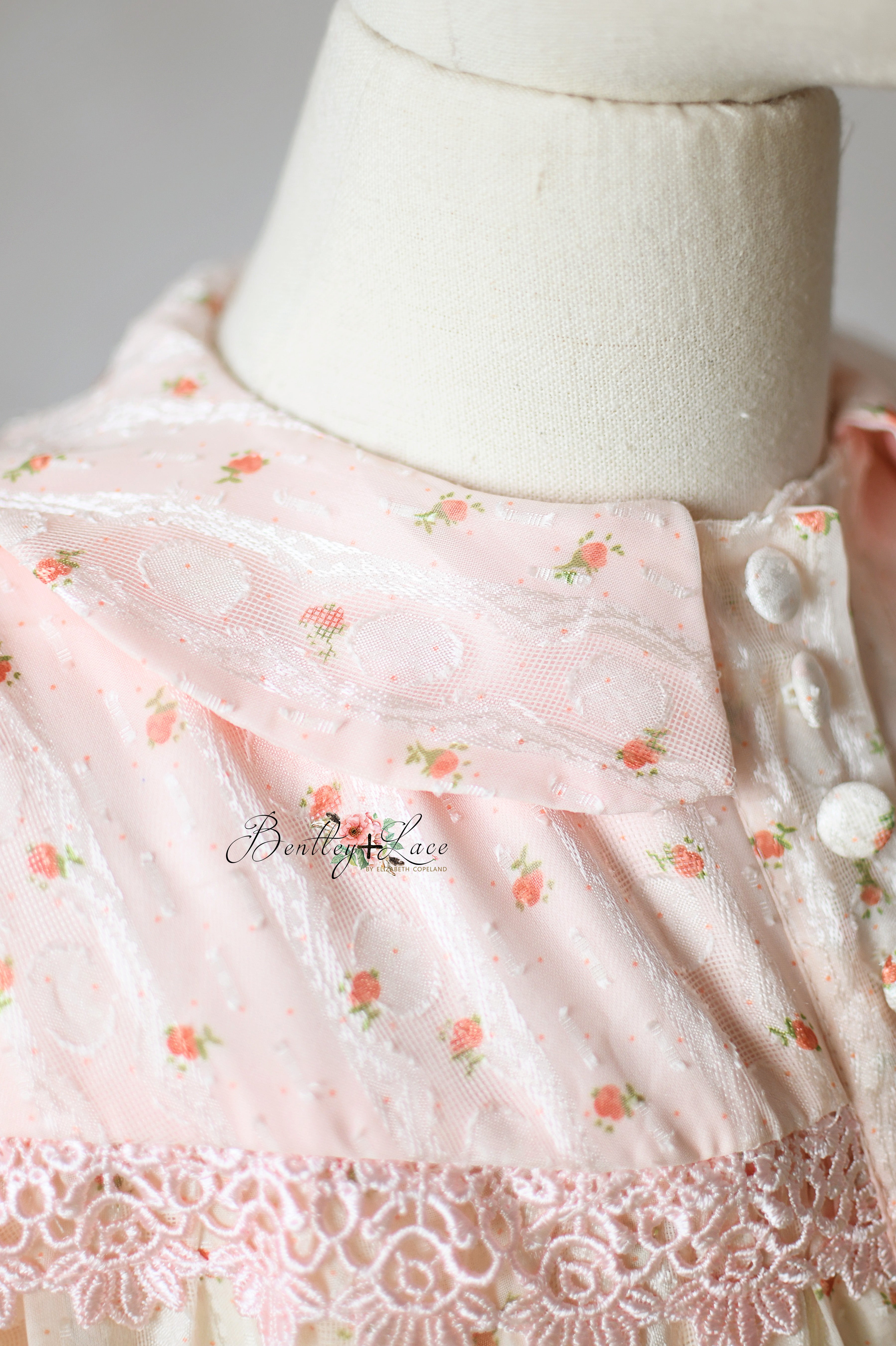 Detail of neckline and rosette appliqué
