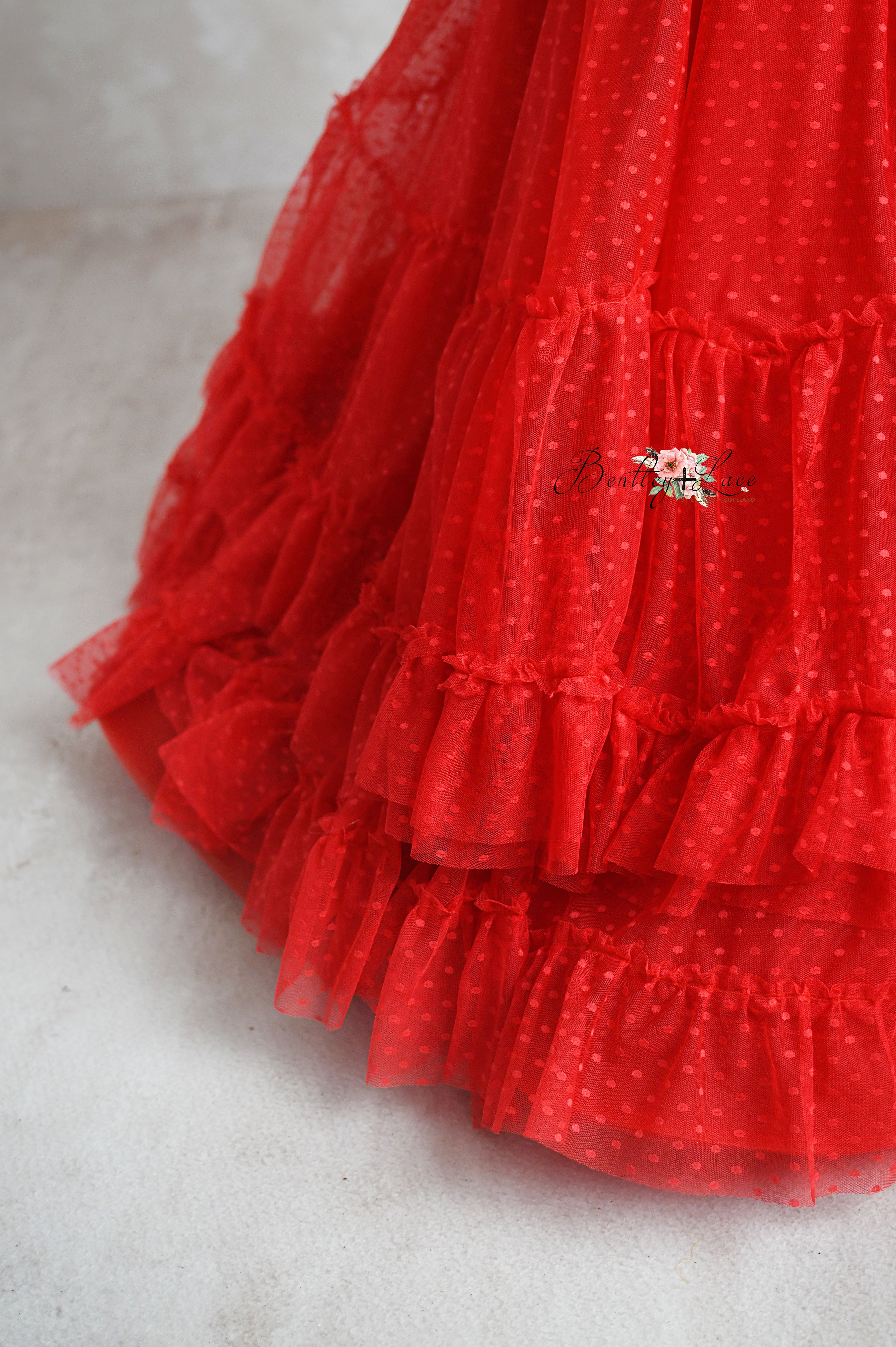 Red Swish Dot Couture gown for girls with adjustable shoulder ties and elastic waistband.