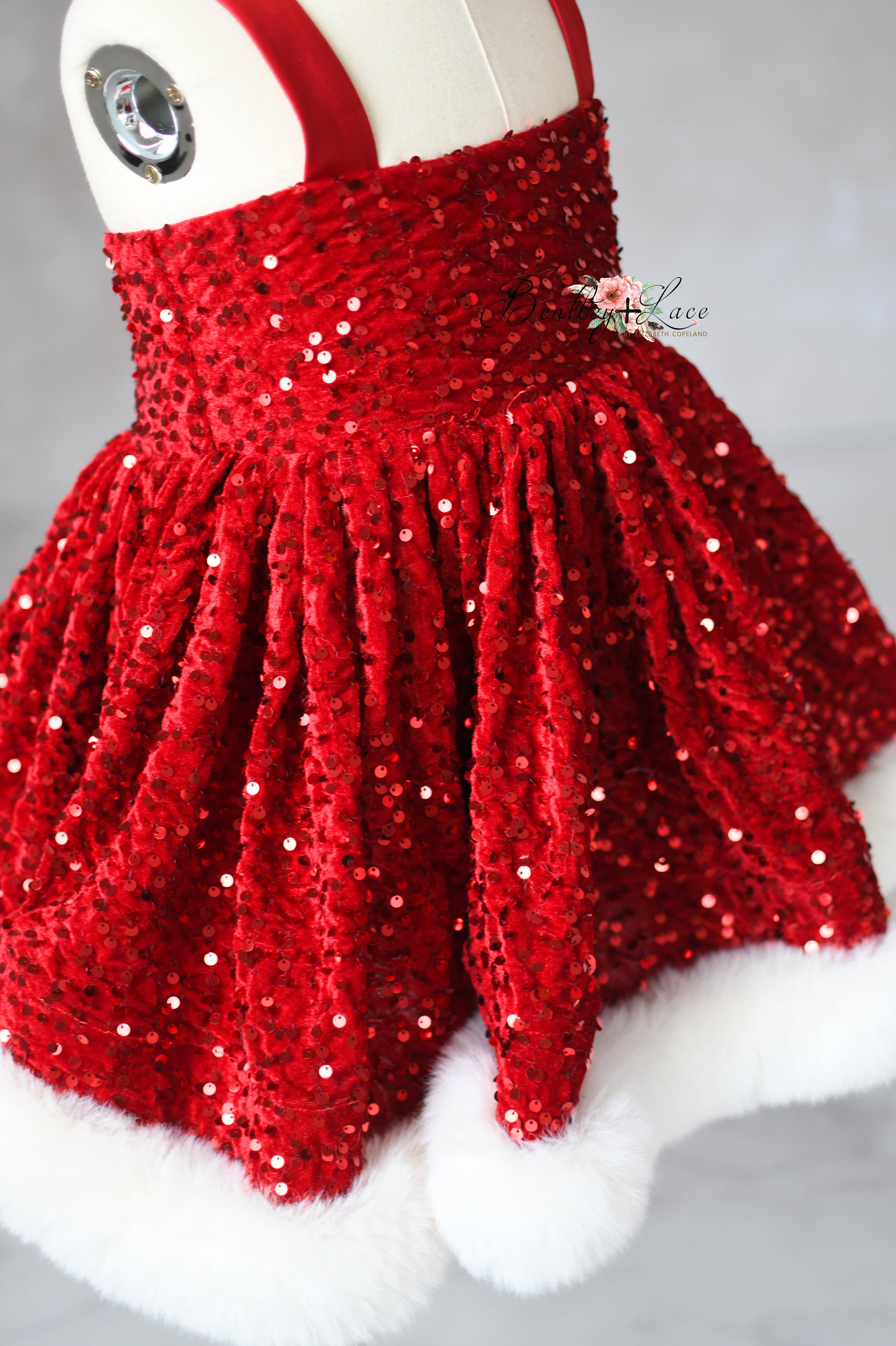 Red sequin skirt on a mannequin with a white background