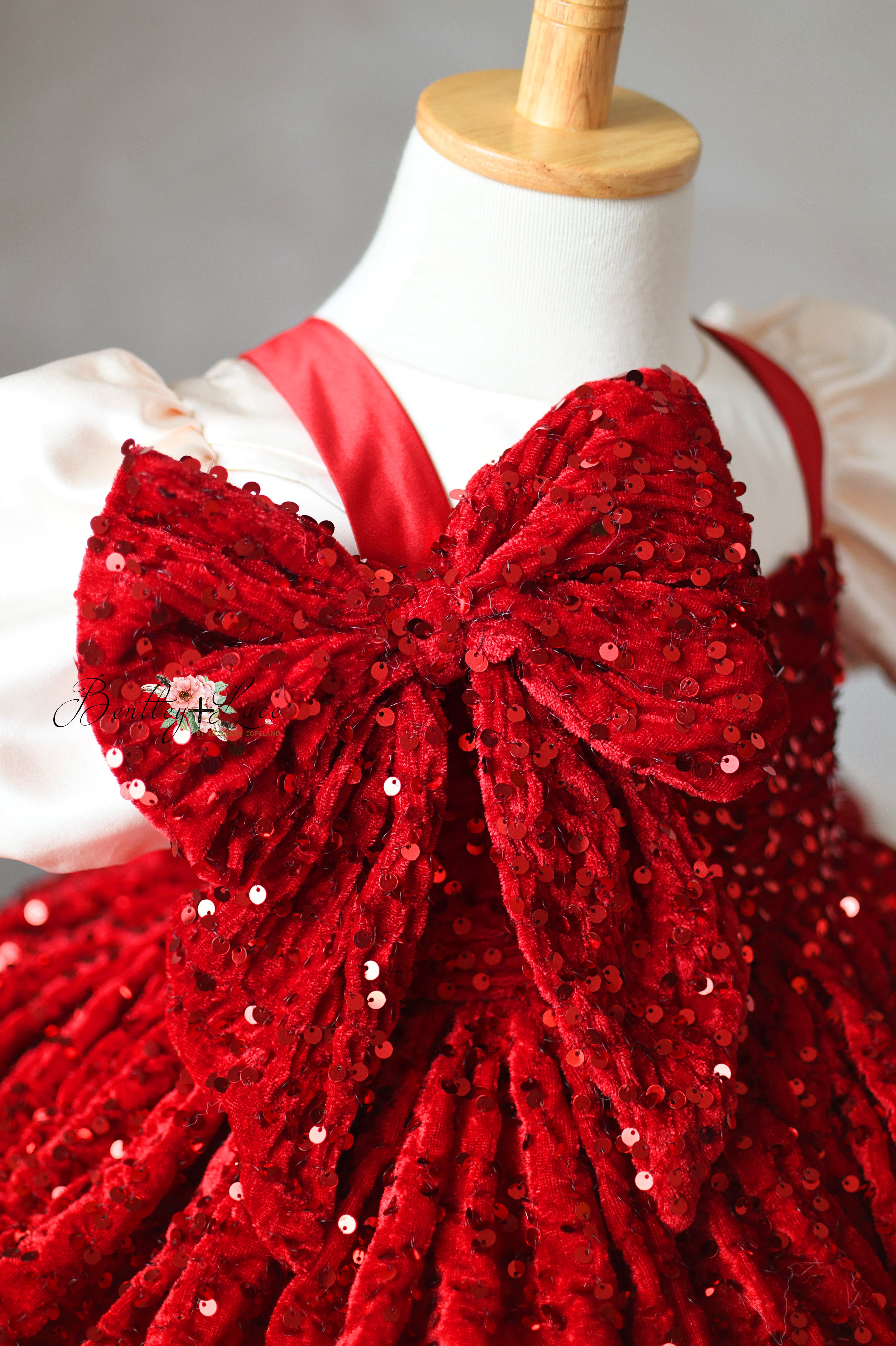 Glittering red gown perfect for Christmas photos and parties.