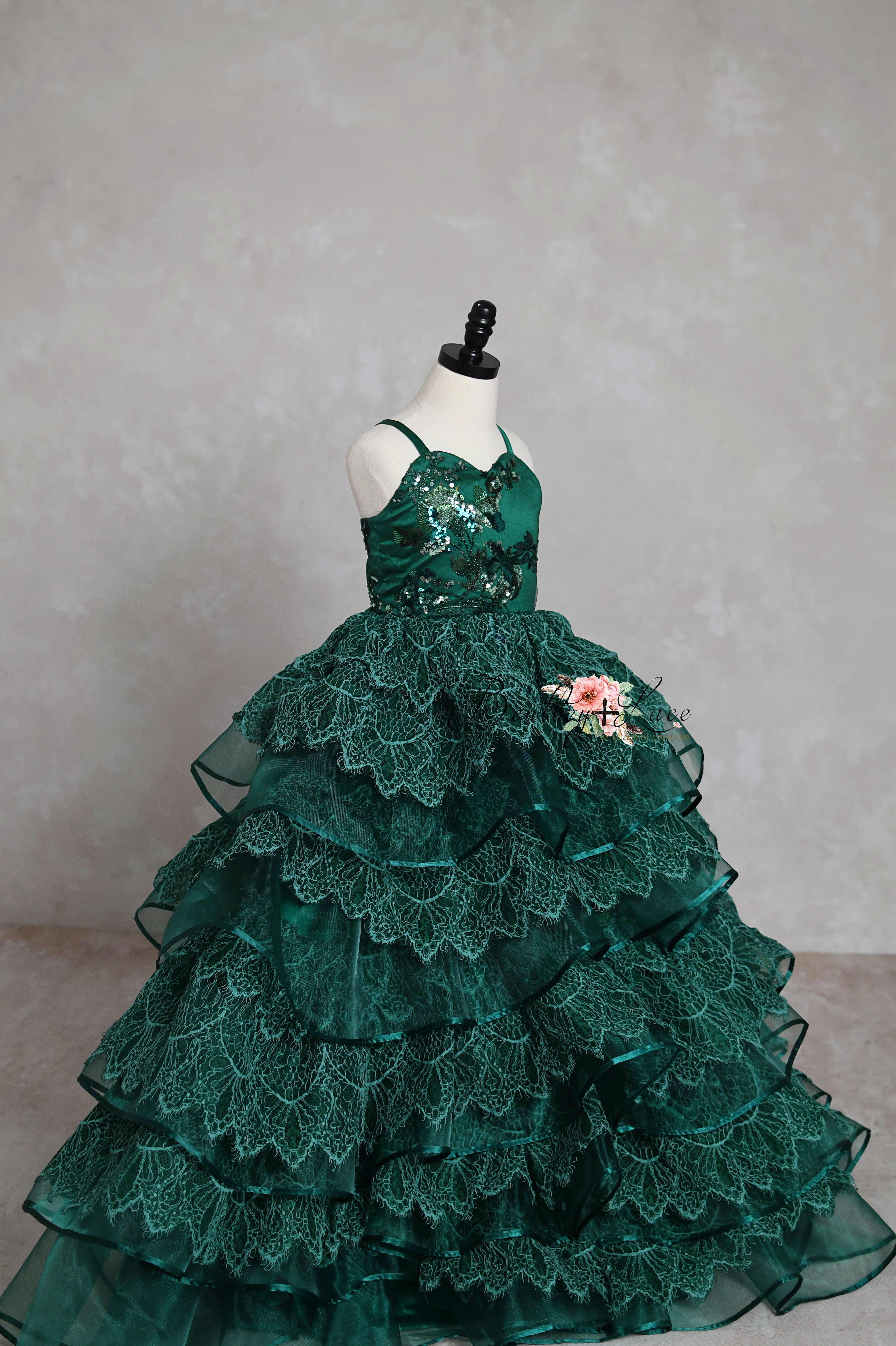 Full view of emerald green sequin and lace toddler ball gown
