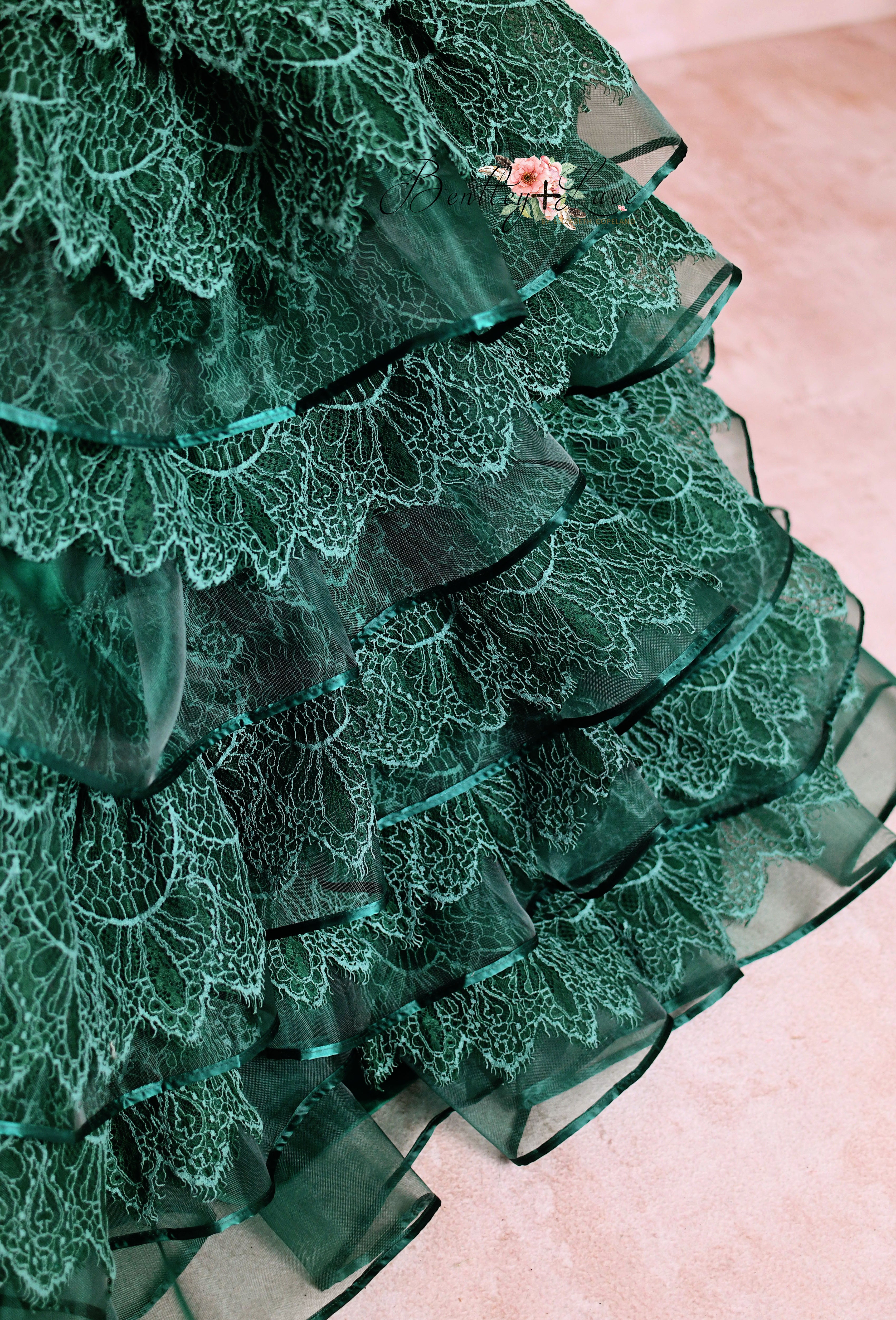 Elegant emerald green gown with floral sequin accents