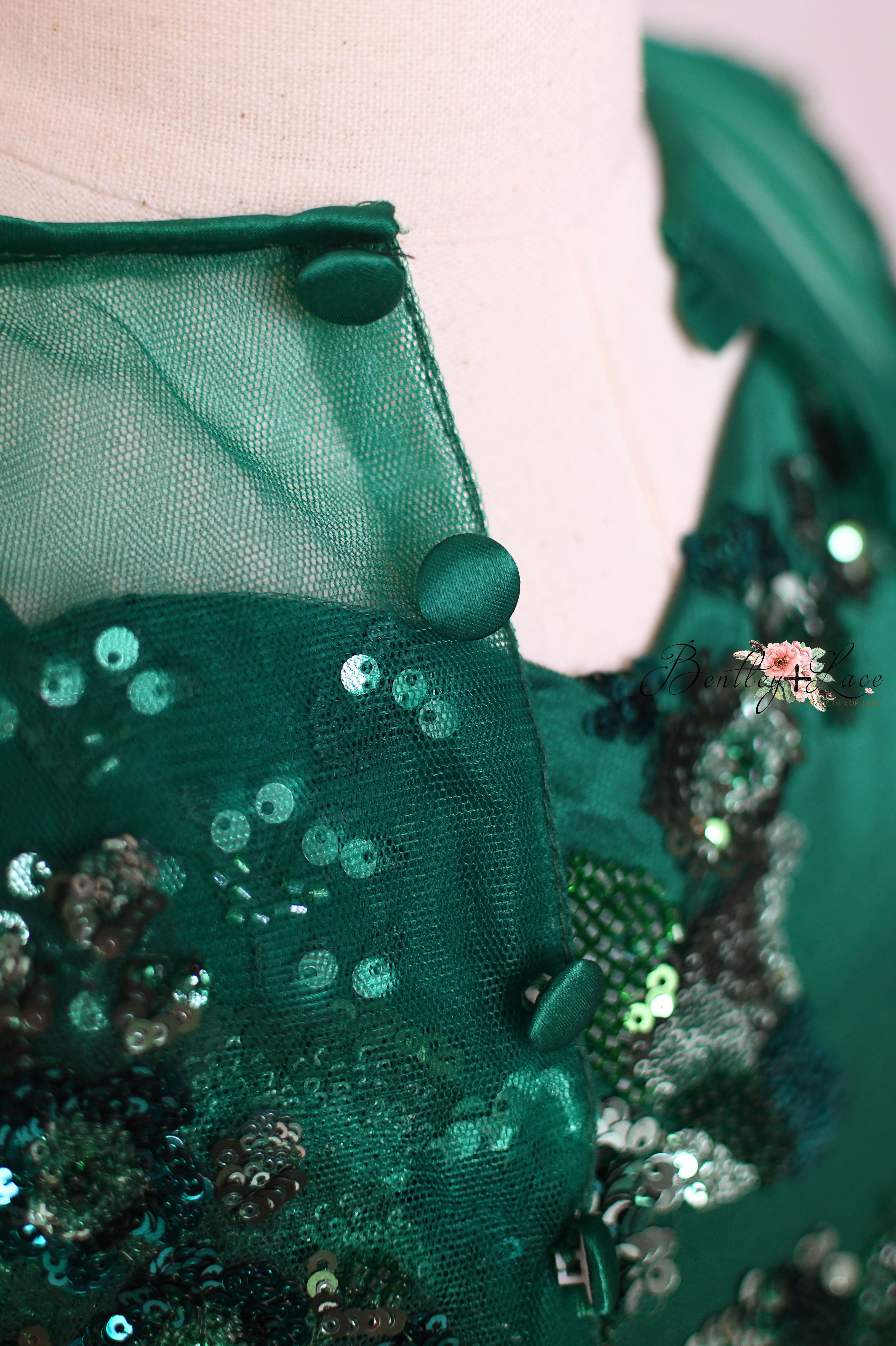 Emerald green layered ball gown with sequin detailing