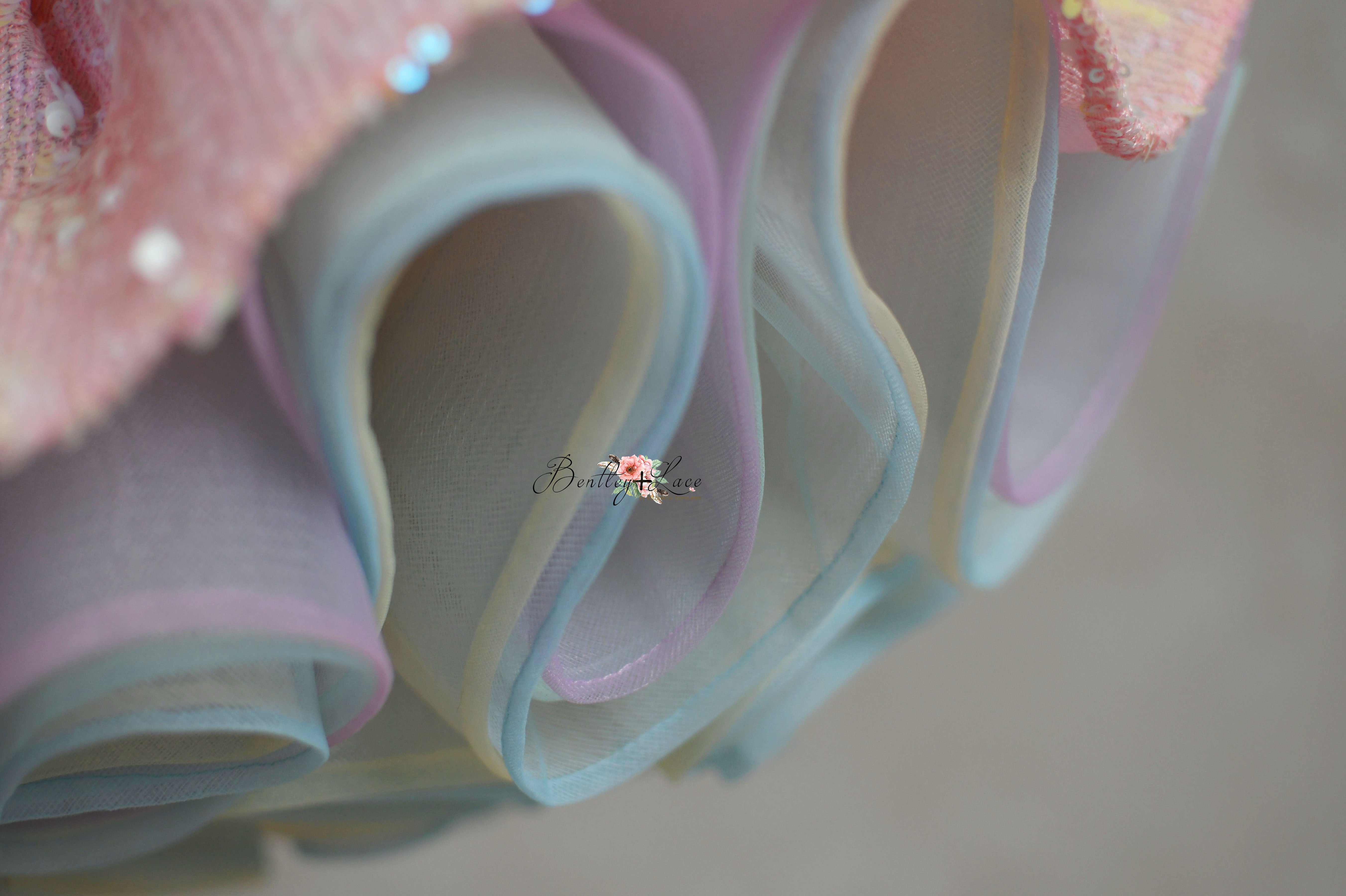 Charming 'Speak Now Gown' with pink sequins and rainbow tulle, perfect for twirling.