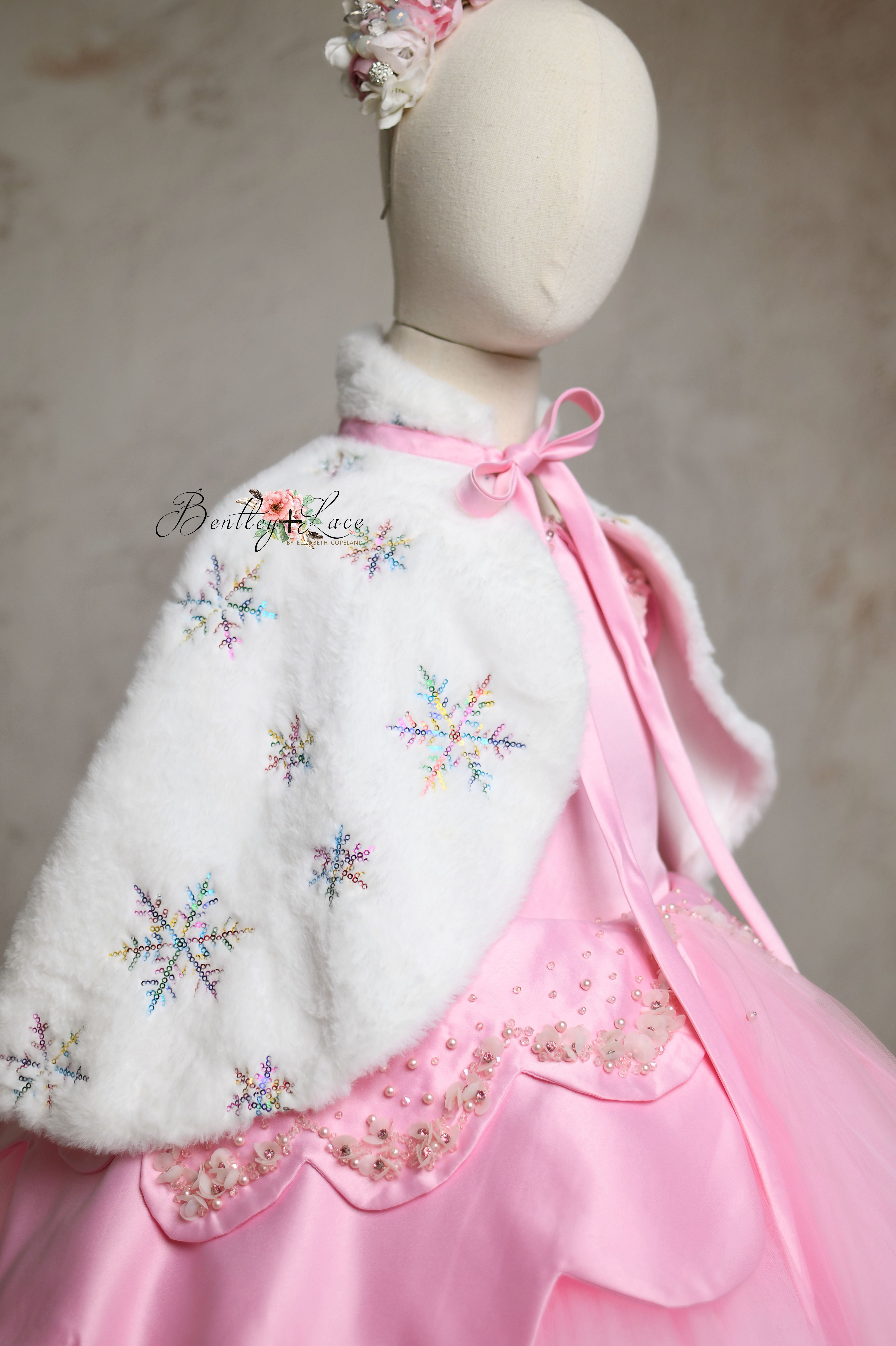 Front view of Ballerina Princess pink satin dress with beaded details and adjustable shoulder ties