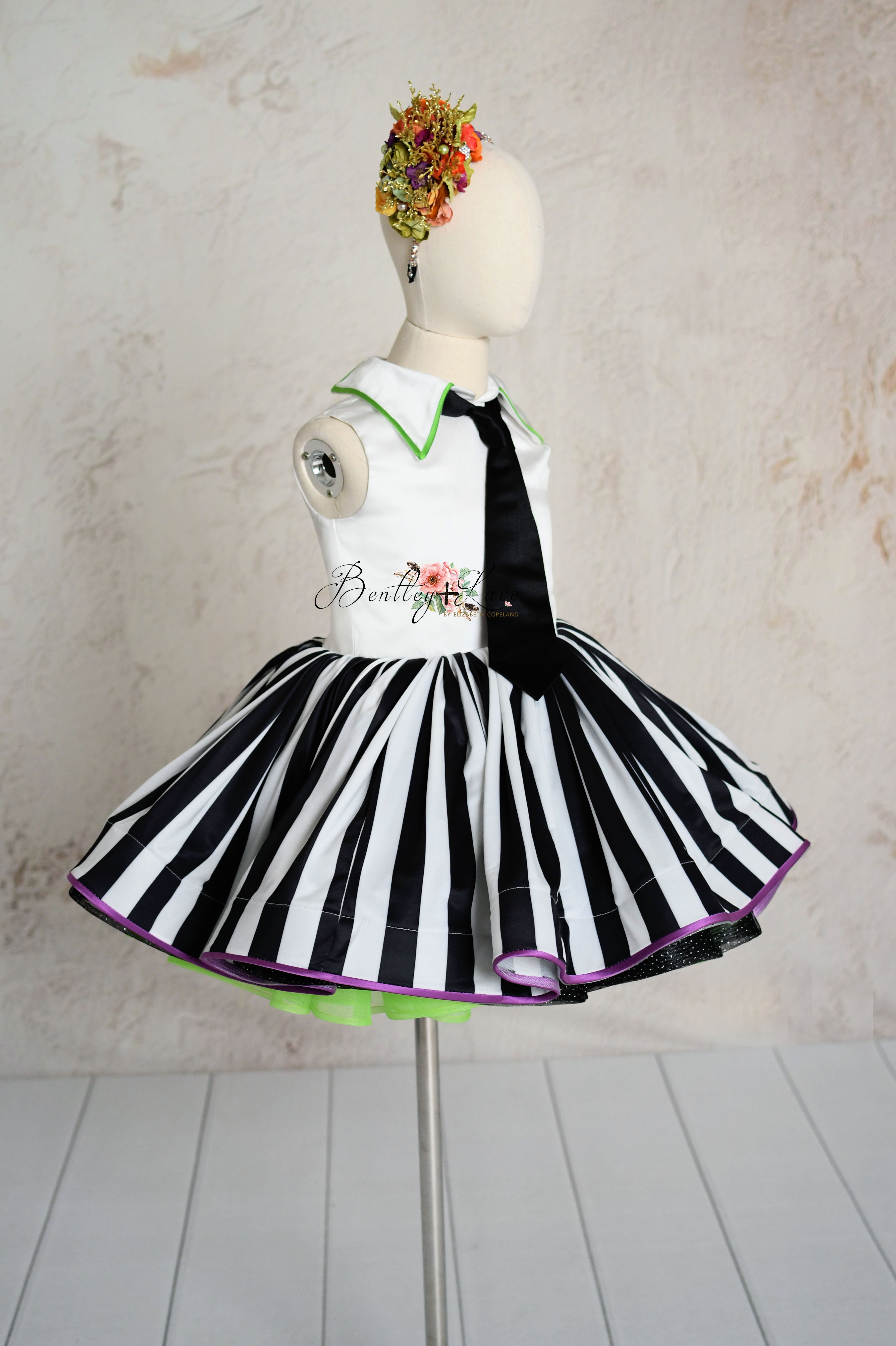 Playful Beetlejuice-inspired dress with jacket for young girls.