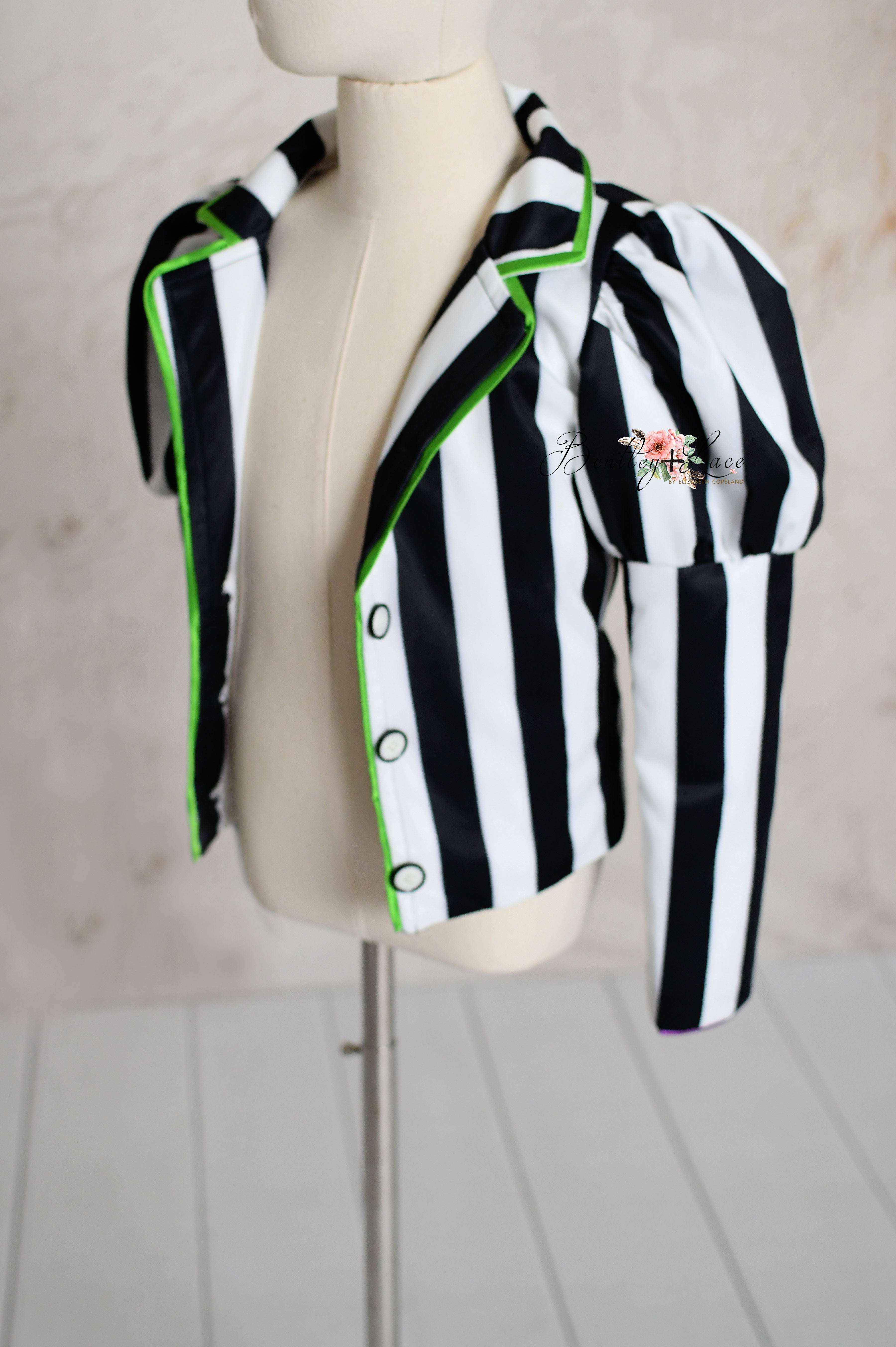 Close-up of black-and-white striped Beetlejuice-themed dress.