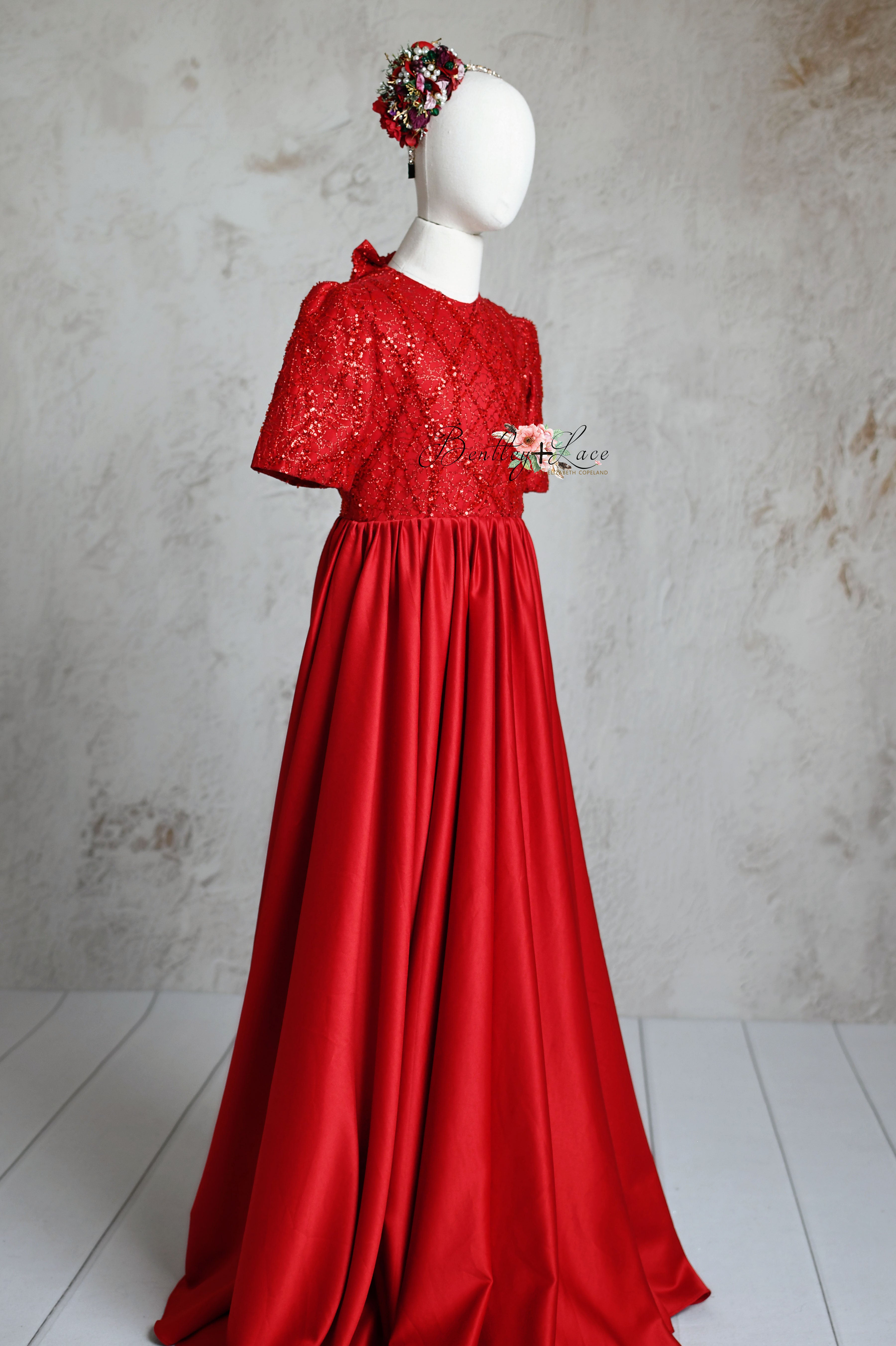 Child's red silk satin dress designed for a glamorous photoshoot.