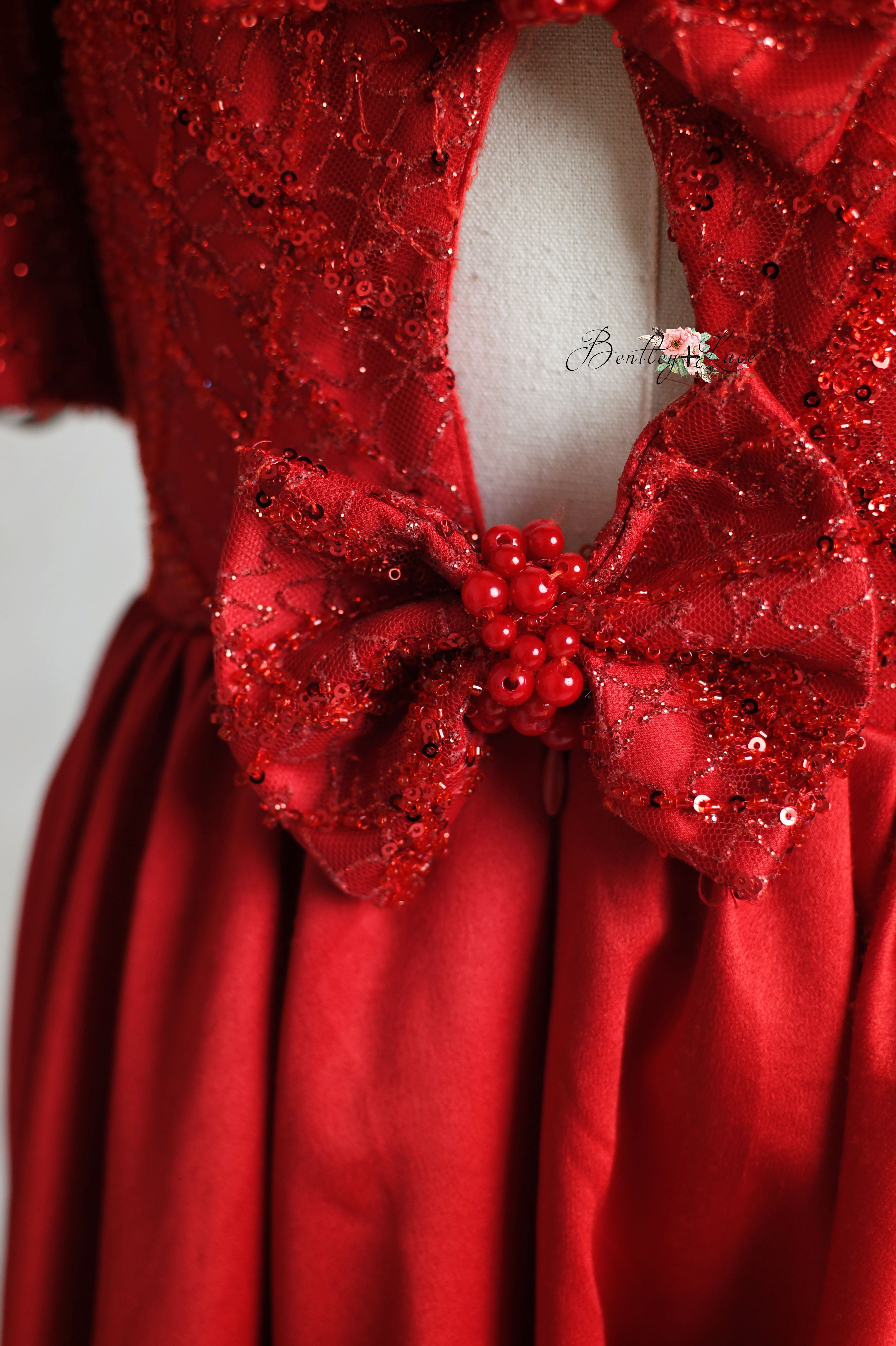 Fashion-forward red silk satin dress with cap sleeve.