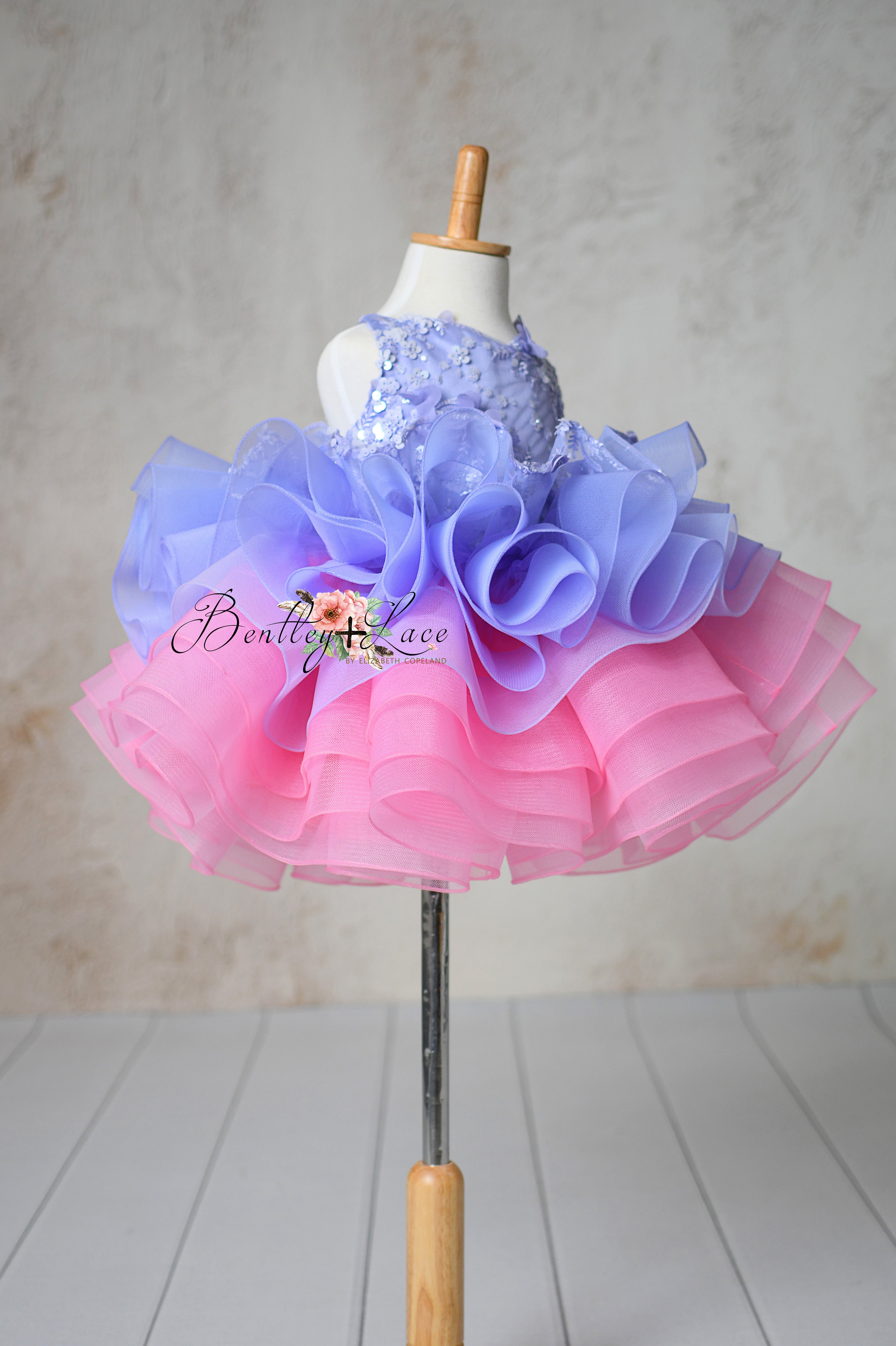 Close-up view of the Lilac Enchantment petal-length dress showcasing the soft tulle skirt in lavender hues.