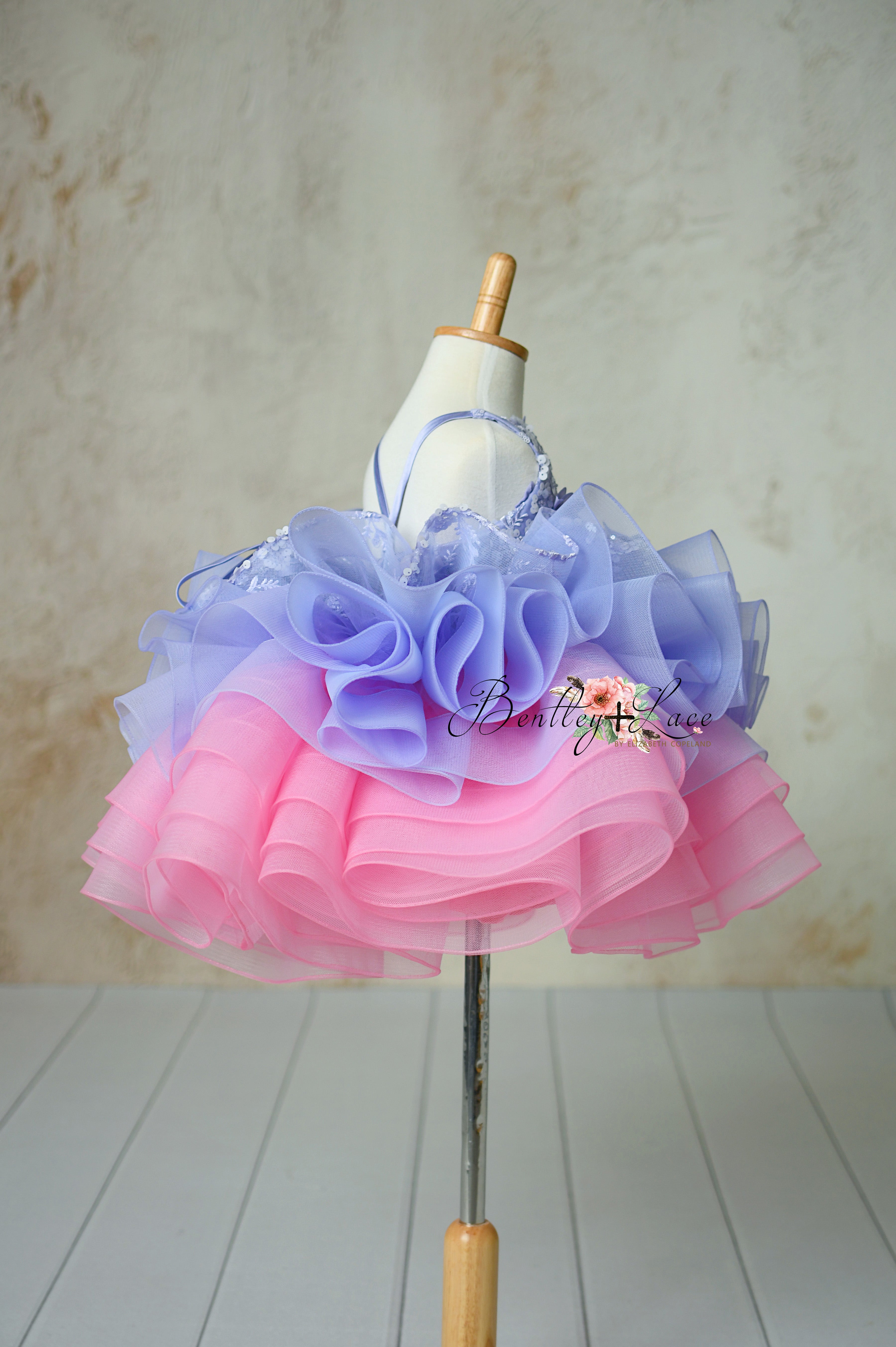 Photography shot highlighting the full tulle skirt of the Lilac Enchantment dress, creating a captivating, ethereal look.