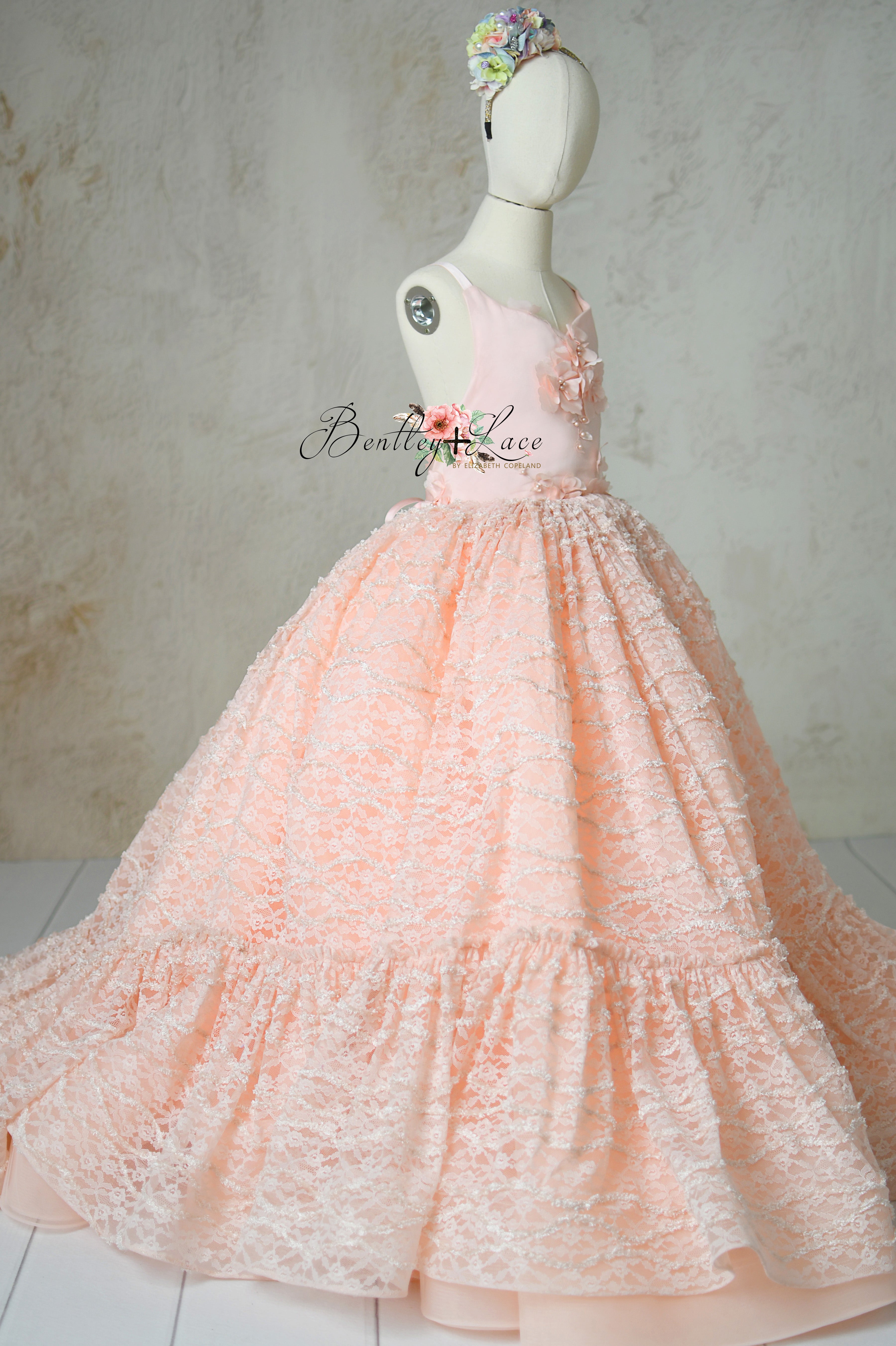 Peachy-pink Rosette Reverie gown with lace overlay and tulle skirt.
