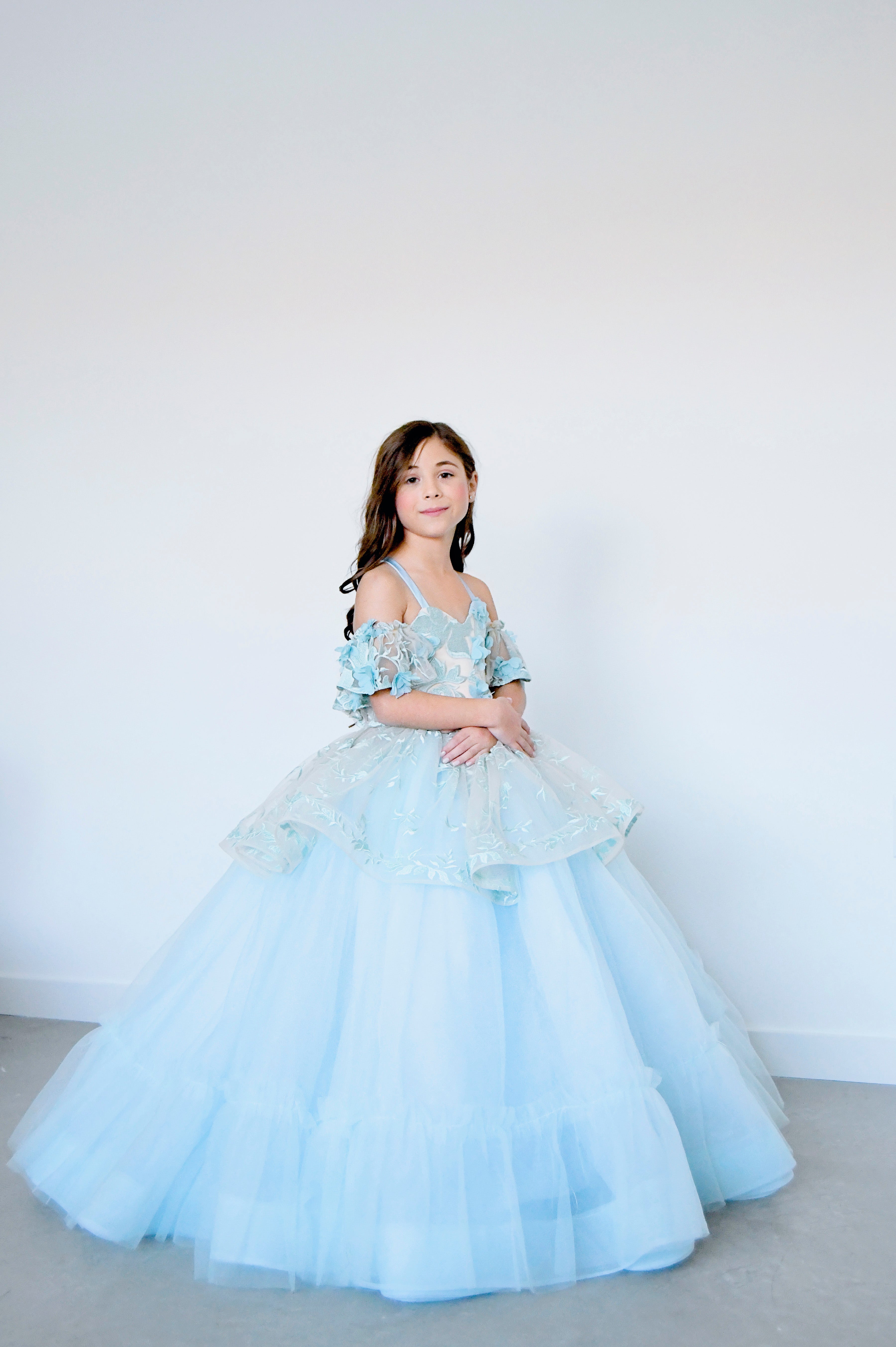 "Soft champagne and blue shades intertwining in the Trésor Caché gown, creating a dreamy and ethereal look."