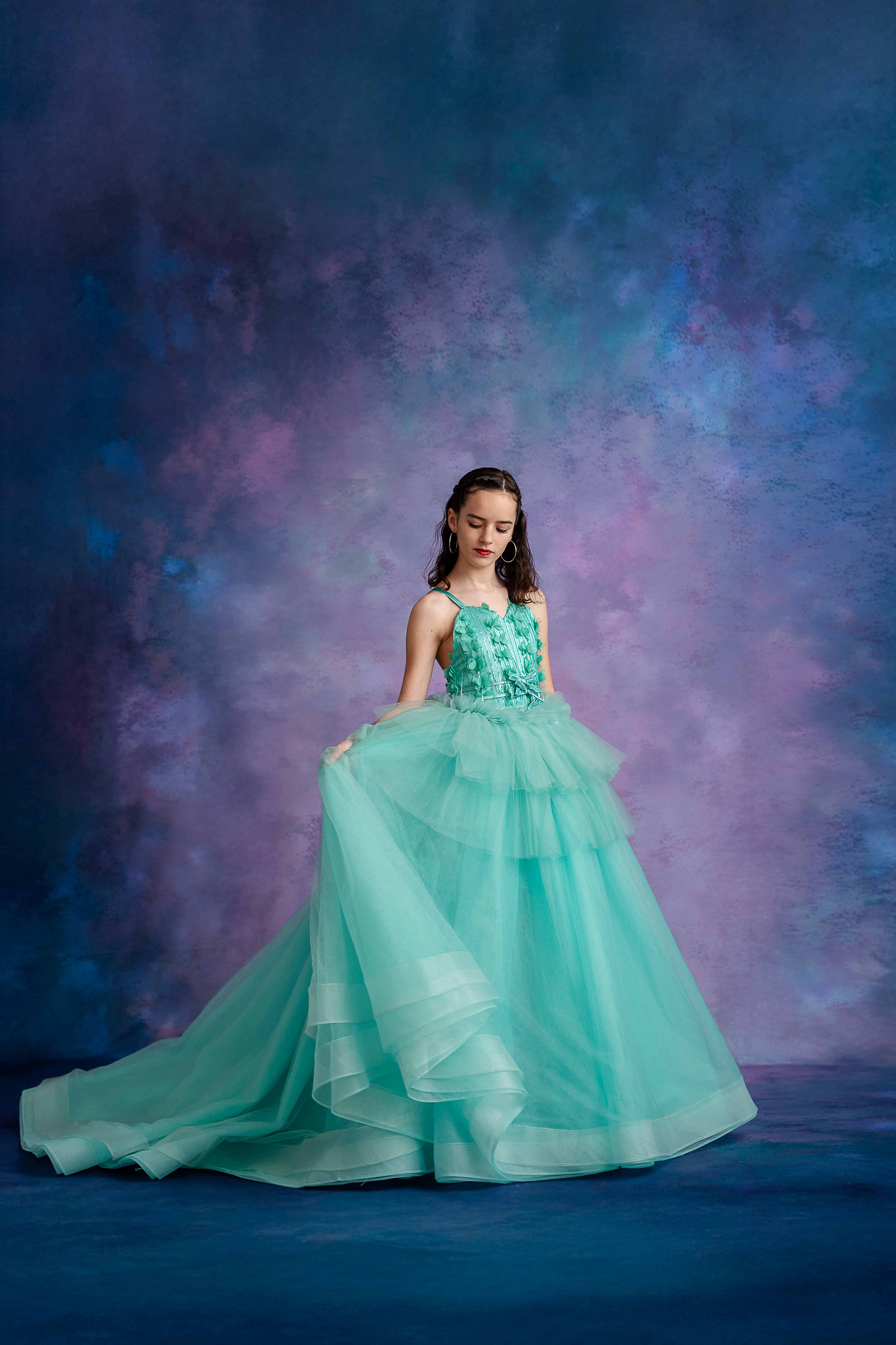 Whimsical aqua gown for girls with flowing tulle skirt and textured bodice