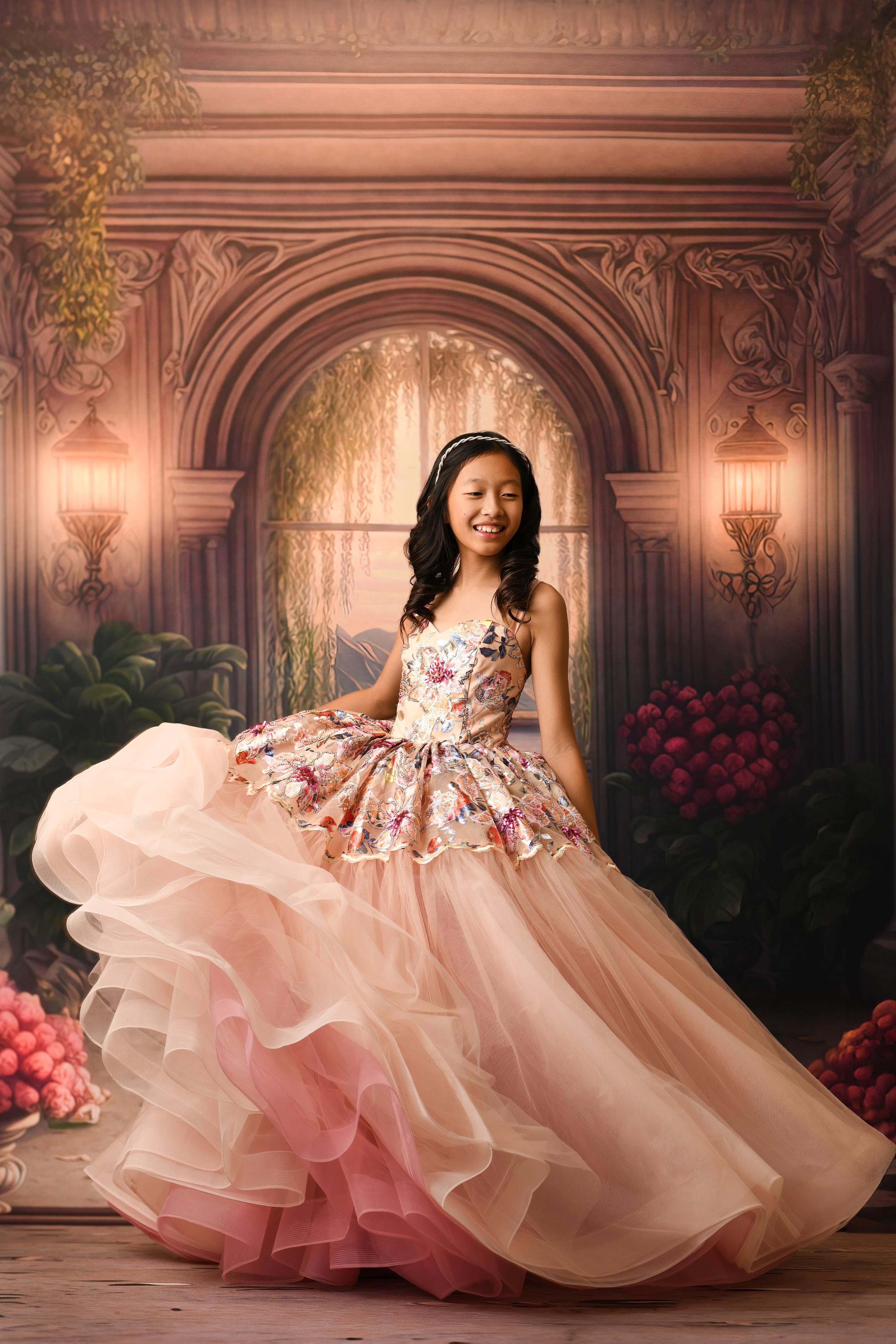 A floor-length gown named "Fleur de Lune" (Moonflower), designed for ages 8-10. This elegant dress features a soft, ethereal design with detachable sleeves for versatility. The gown flows gracefully to the floor, creating a delicate, timeless silhouette suitable for formal or fantasy-inspired photoshoots.