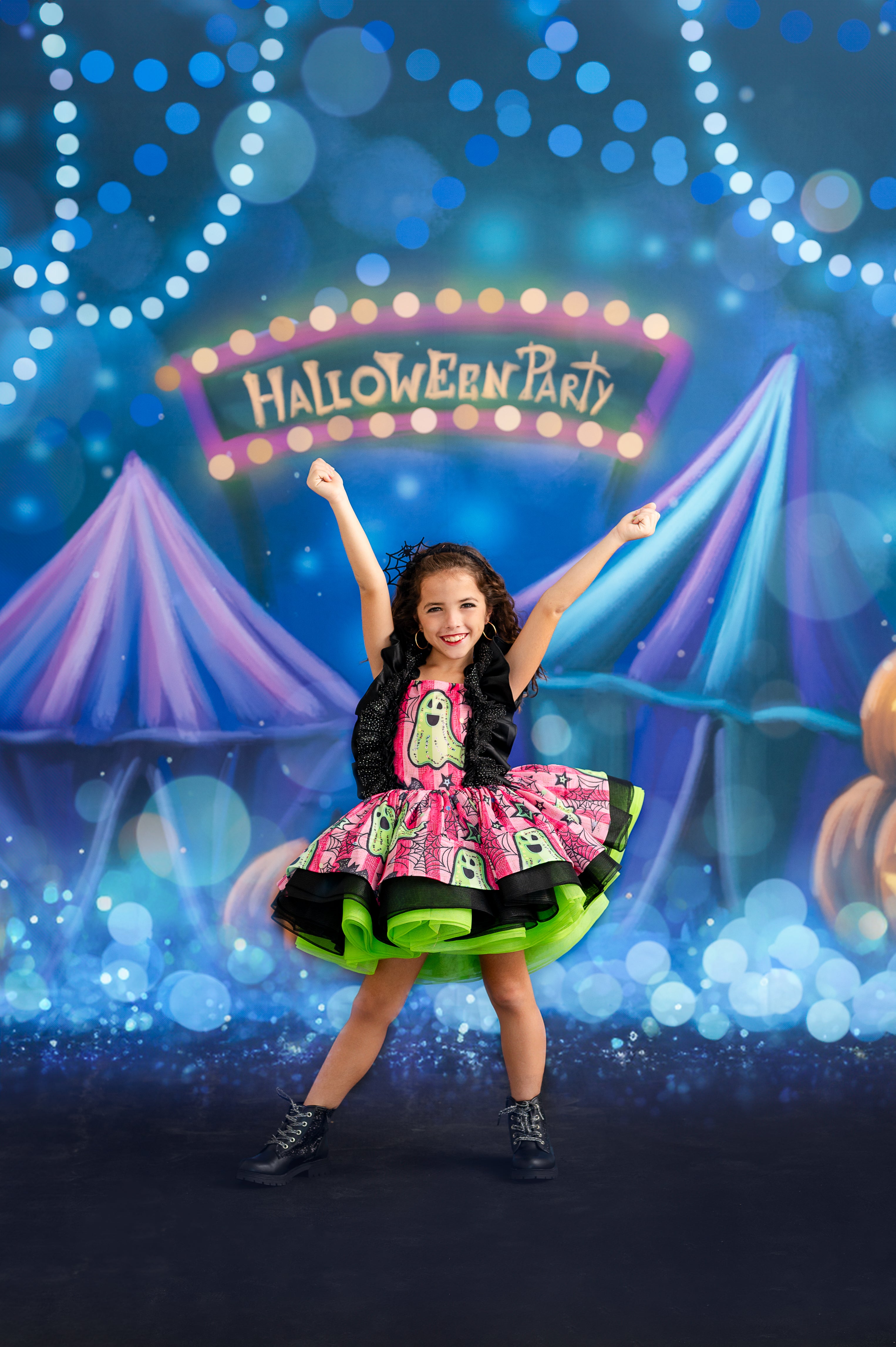 Little girl in a witch-themed Halloween dress, perfect for a whimsical photo shoot