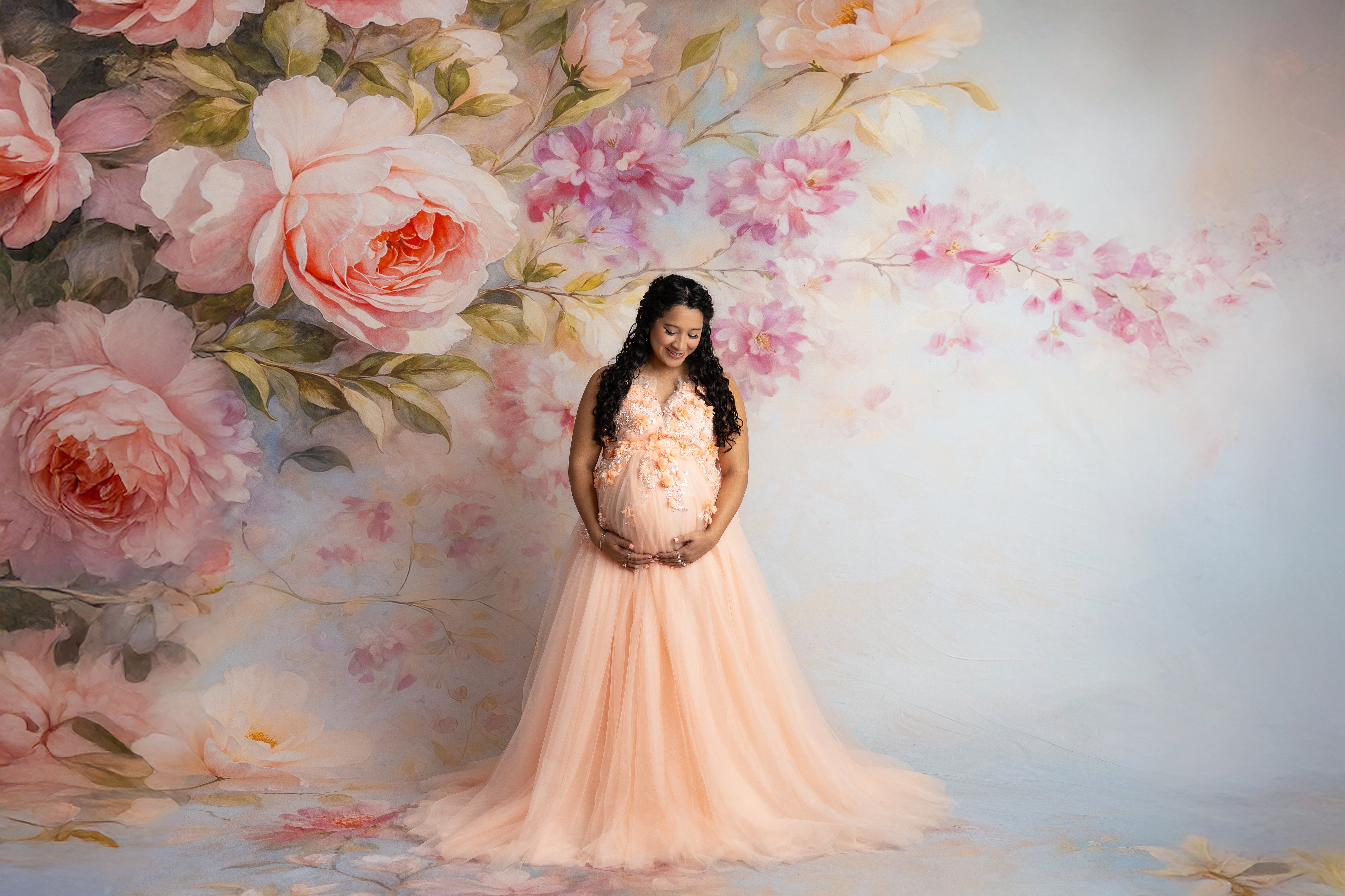 Soft peach maternity gown with adjustable corset back and airy tulle layers.