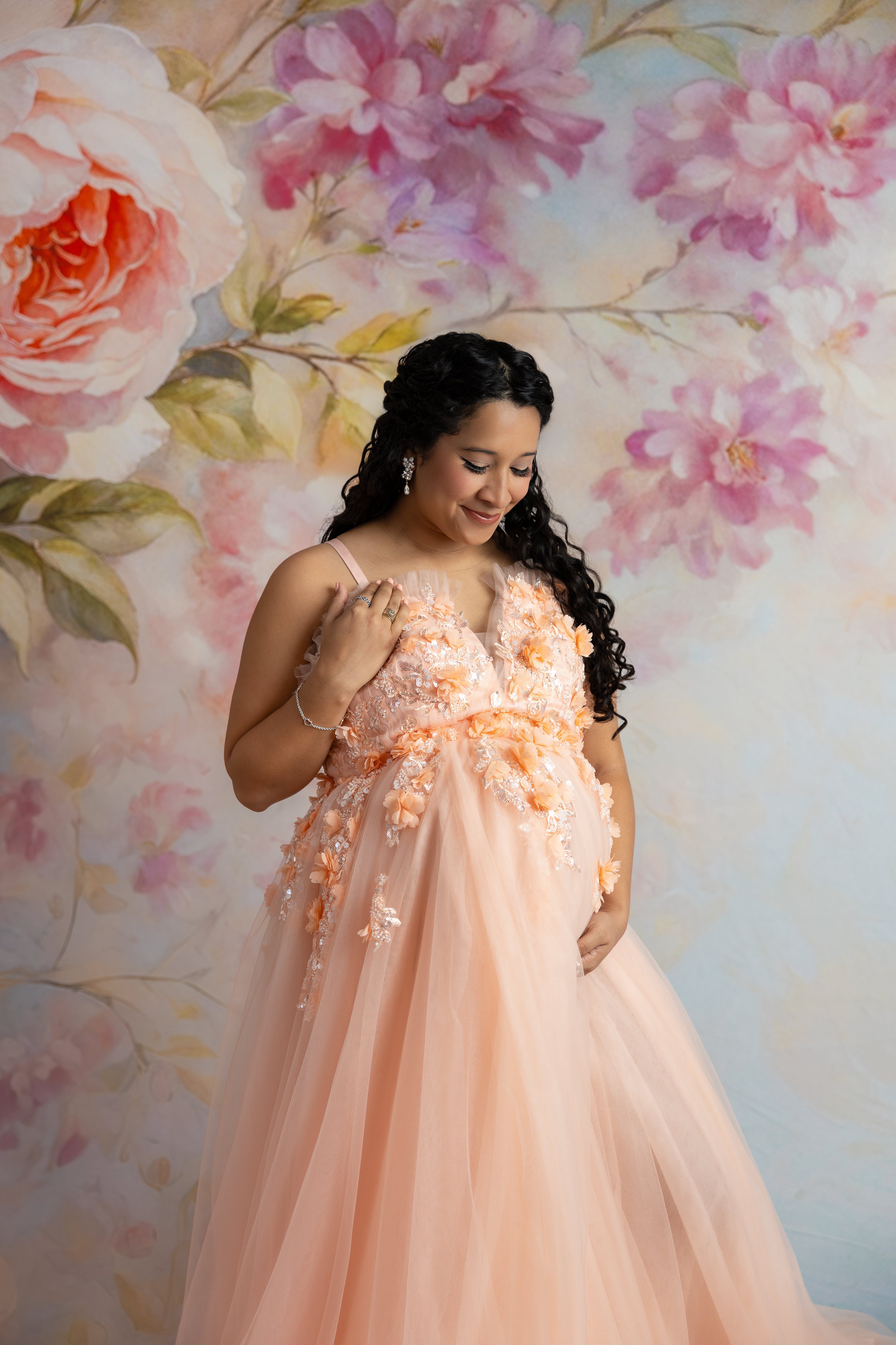 Peach-hued gown with corseted bodice, perfect for photo sessions or special events.