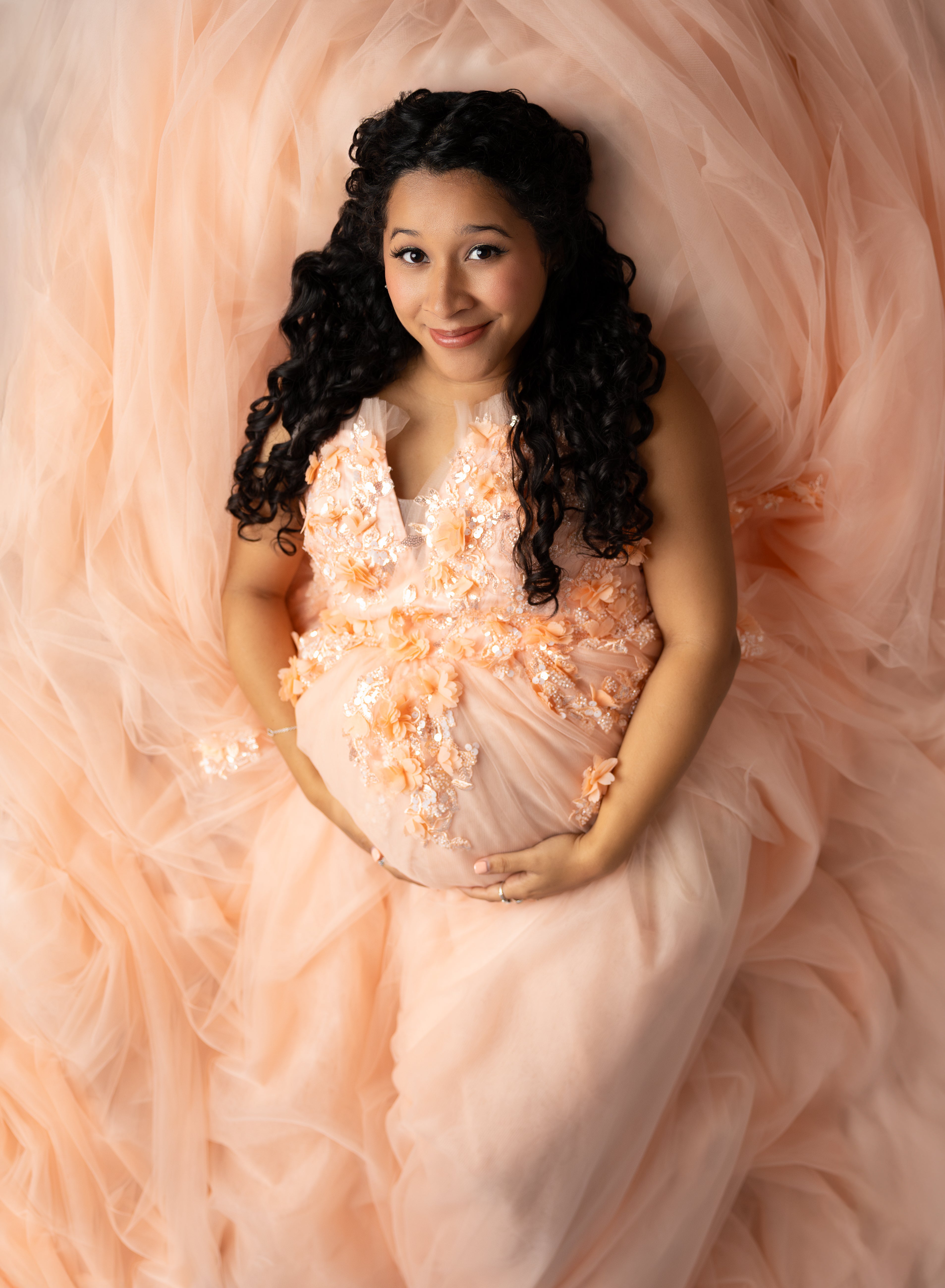 Peach Blossom gown in soft tulle, designed to flatter maternity and standard silhouettes.