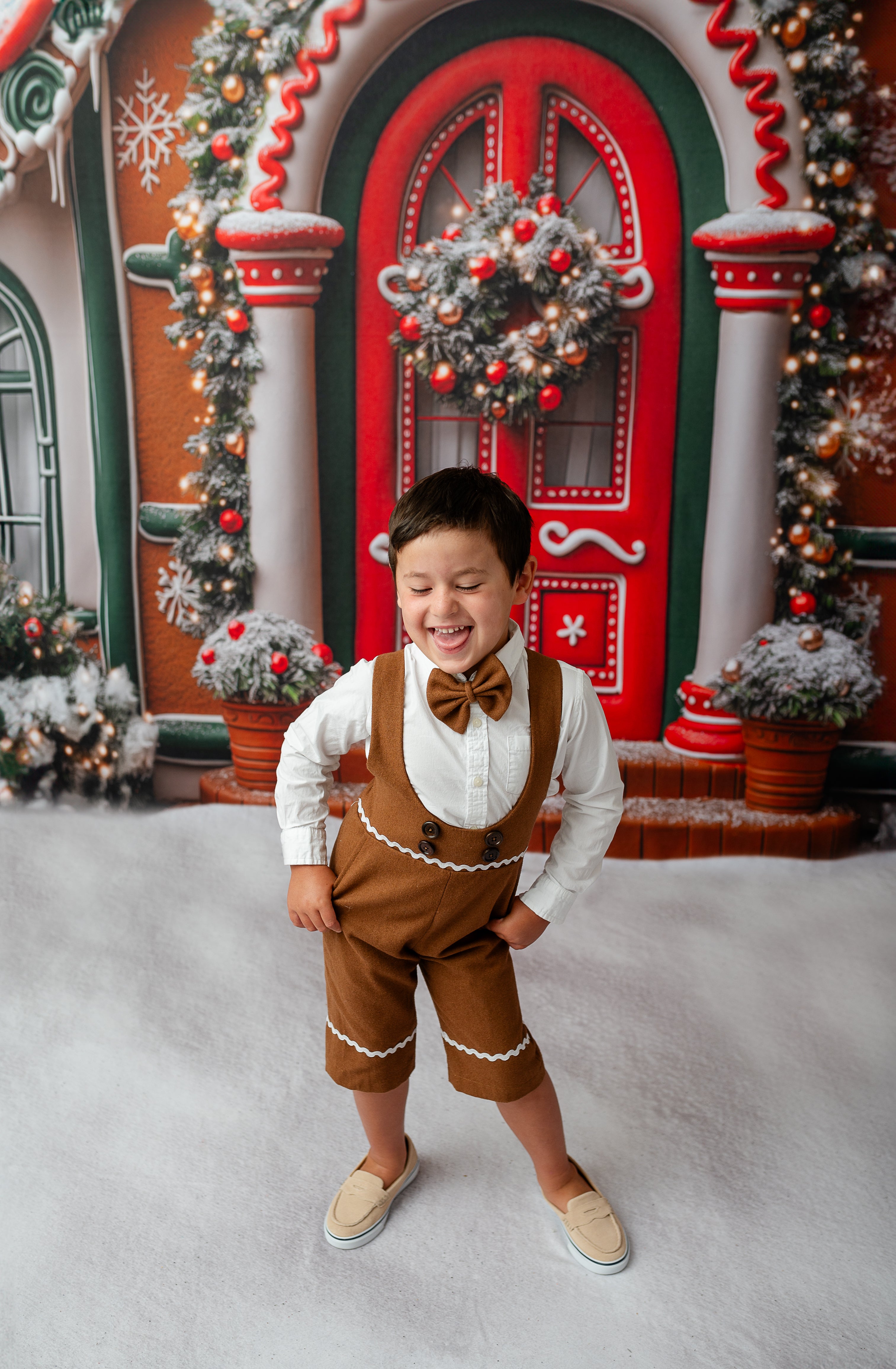 boy wearing custom gingerbread themed suspender shorts