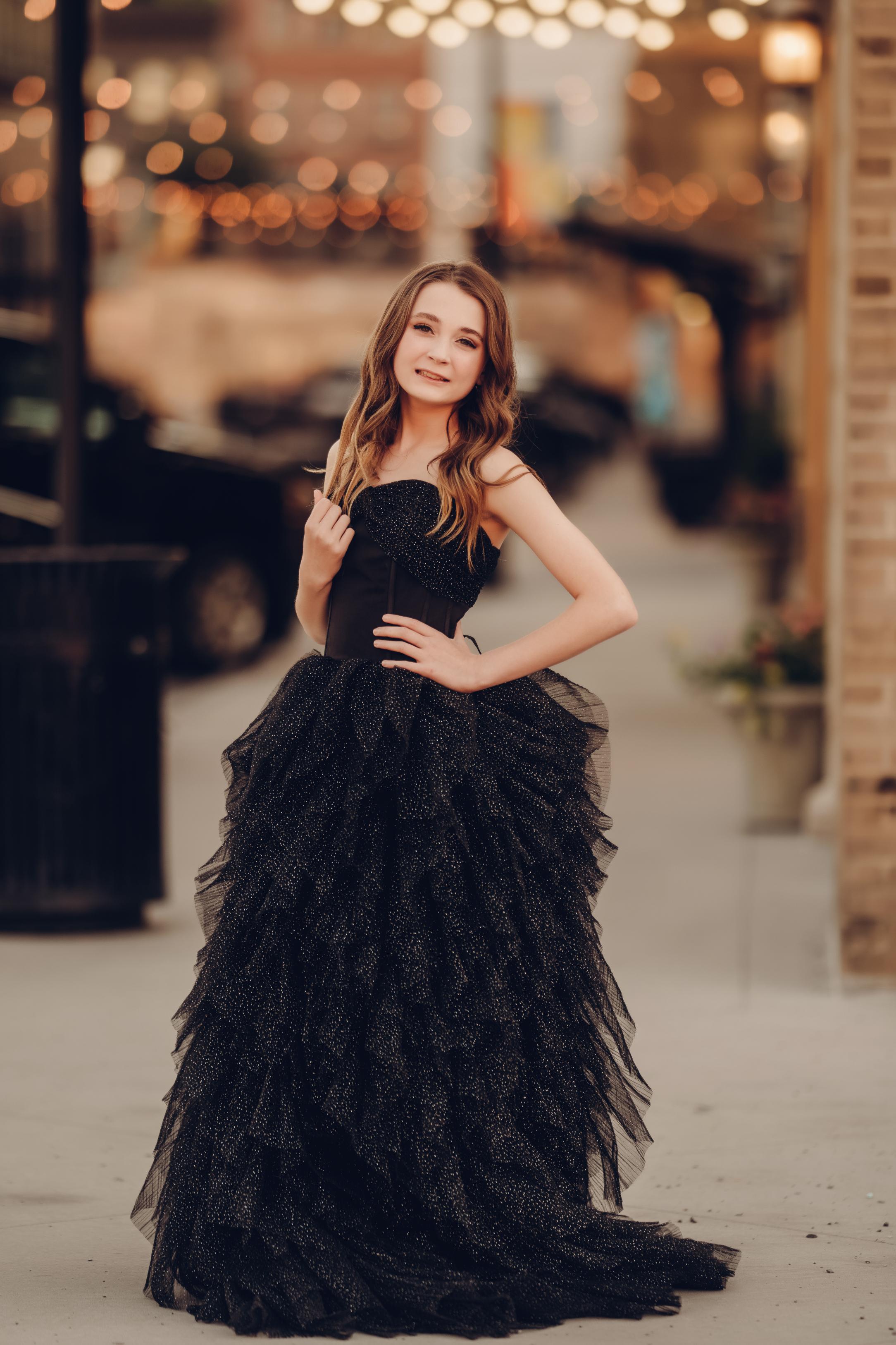 girl wearing a beautiful black sparkle gown