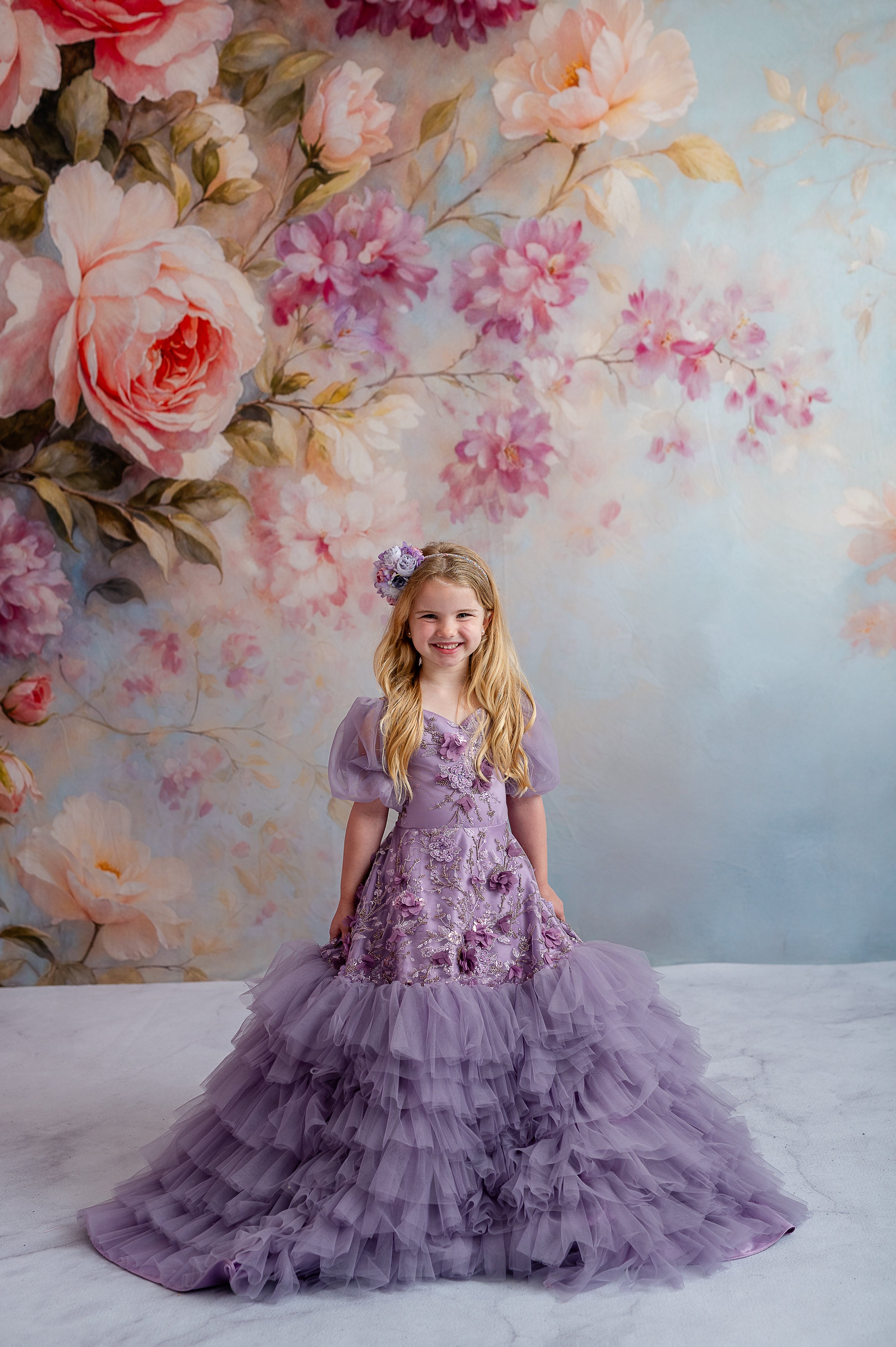 Matching mommy and me lavender gowns with flowing skirts and soft floral details.