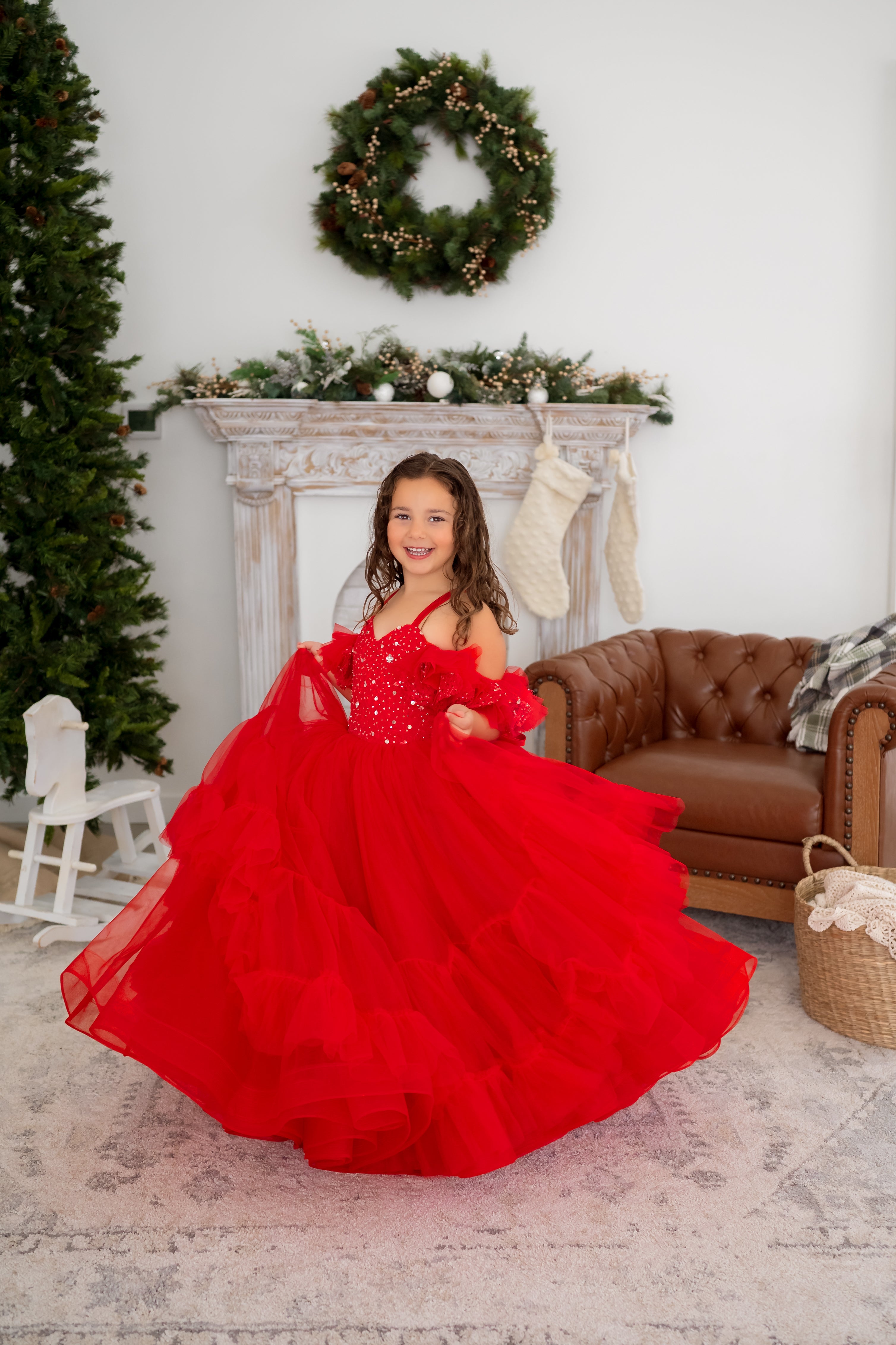 girl wearing a red holiday gown