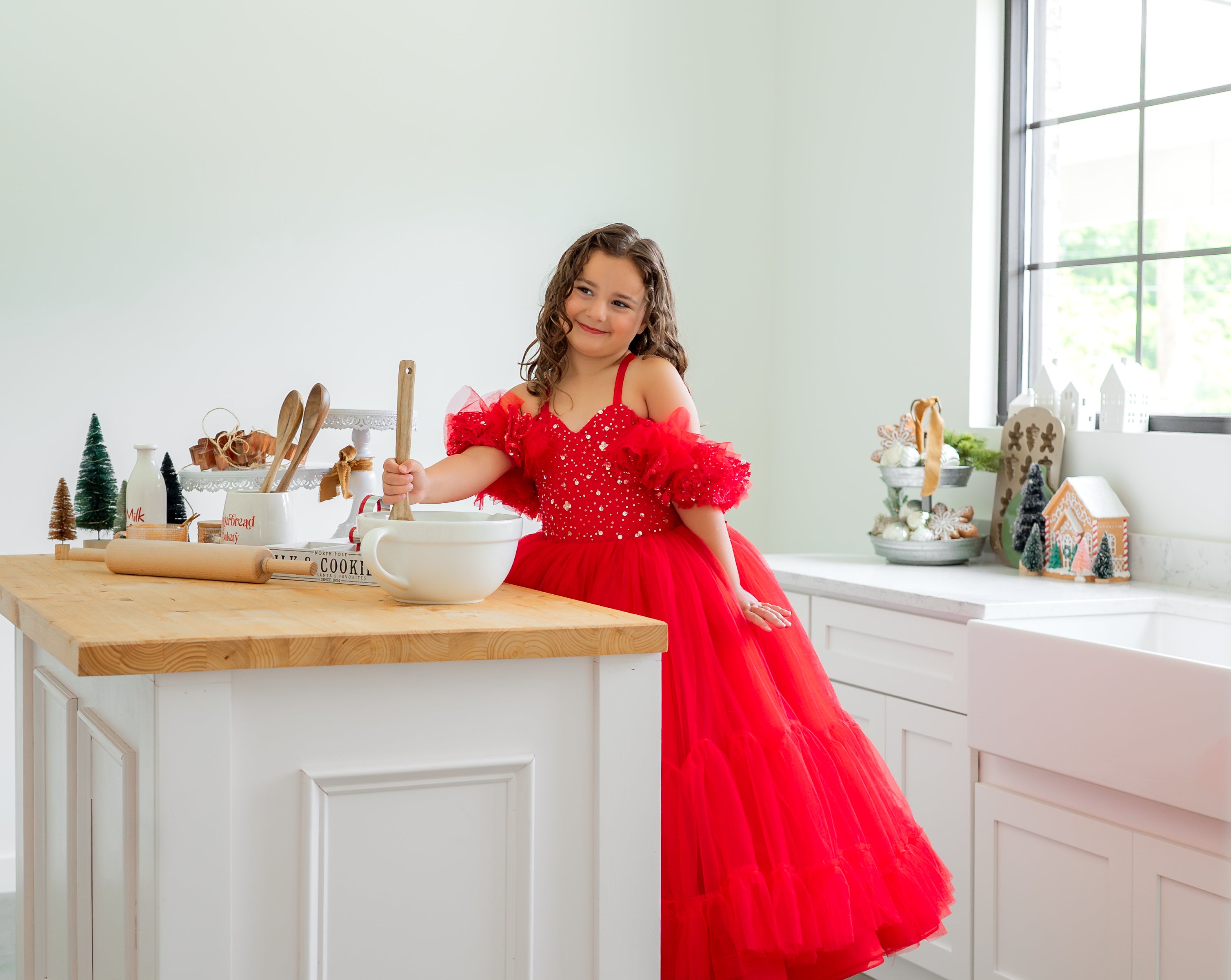 custom red gowns for holiday baking photo shoot