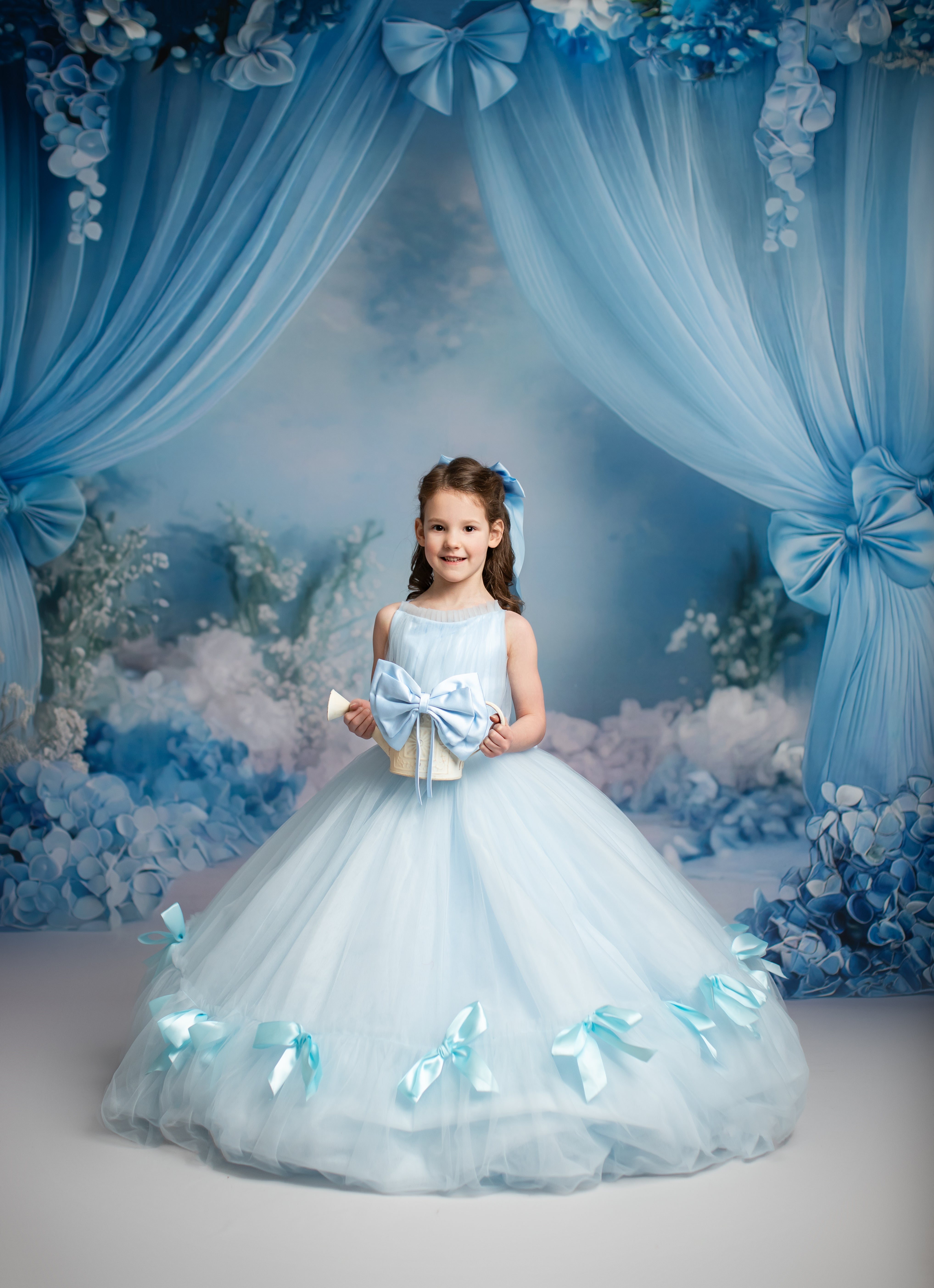 Bows of Grace long gown with flowing soft tulle and satin bow accents.