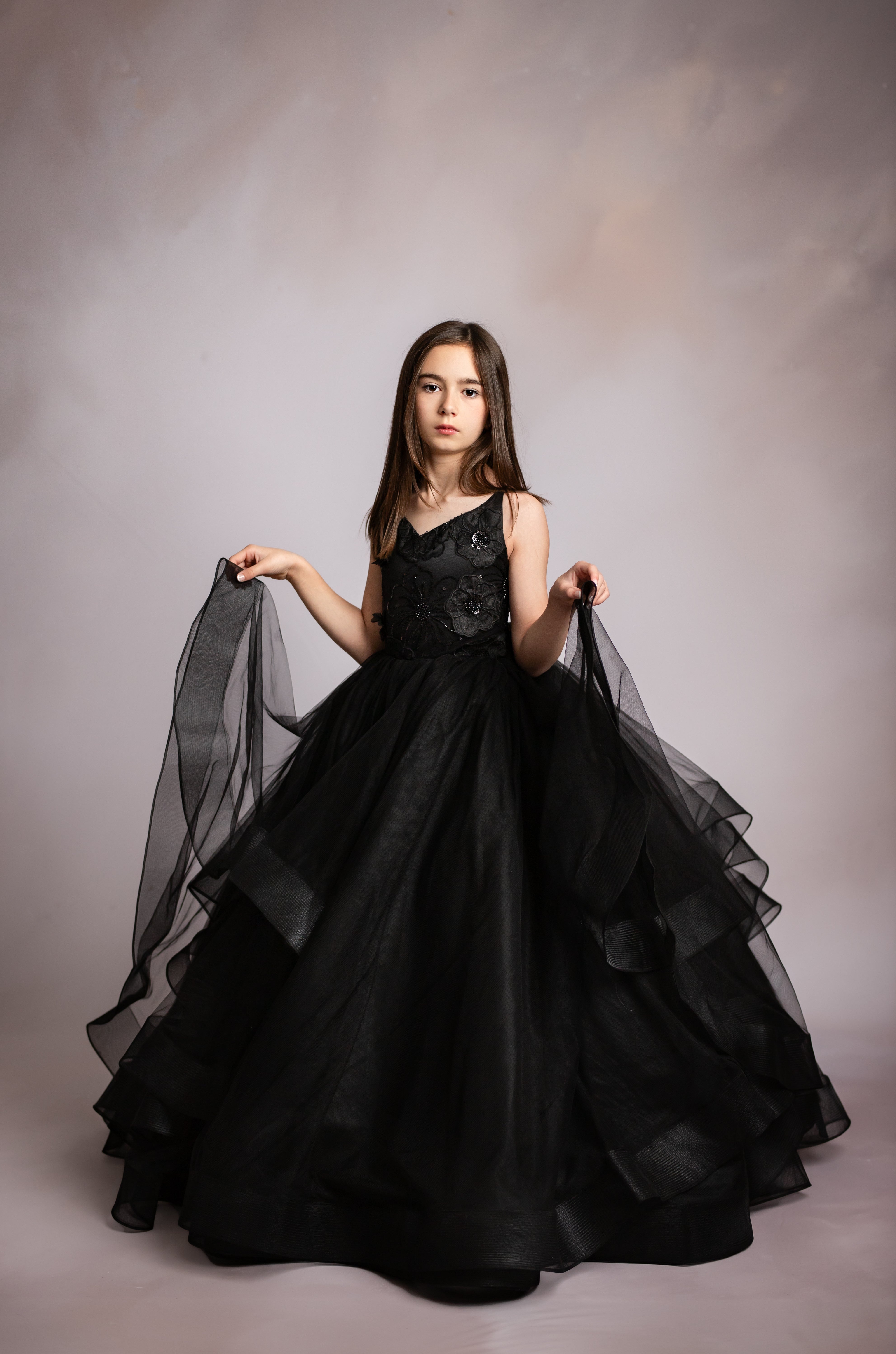 "Young girl twirling in the Seraphina Grace gown, ideal for birthday and milestone photos"