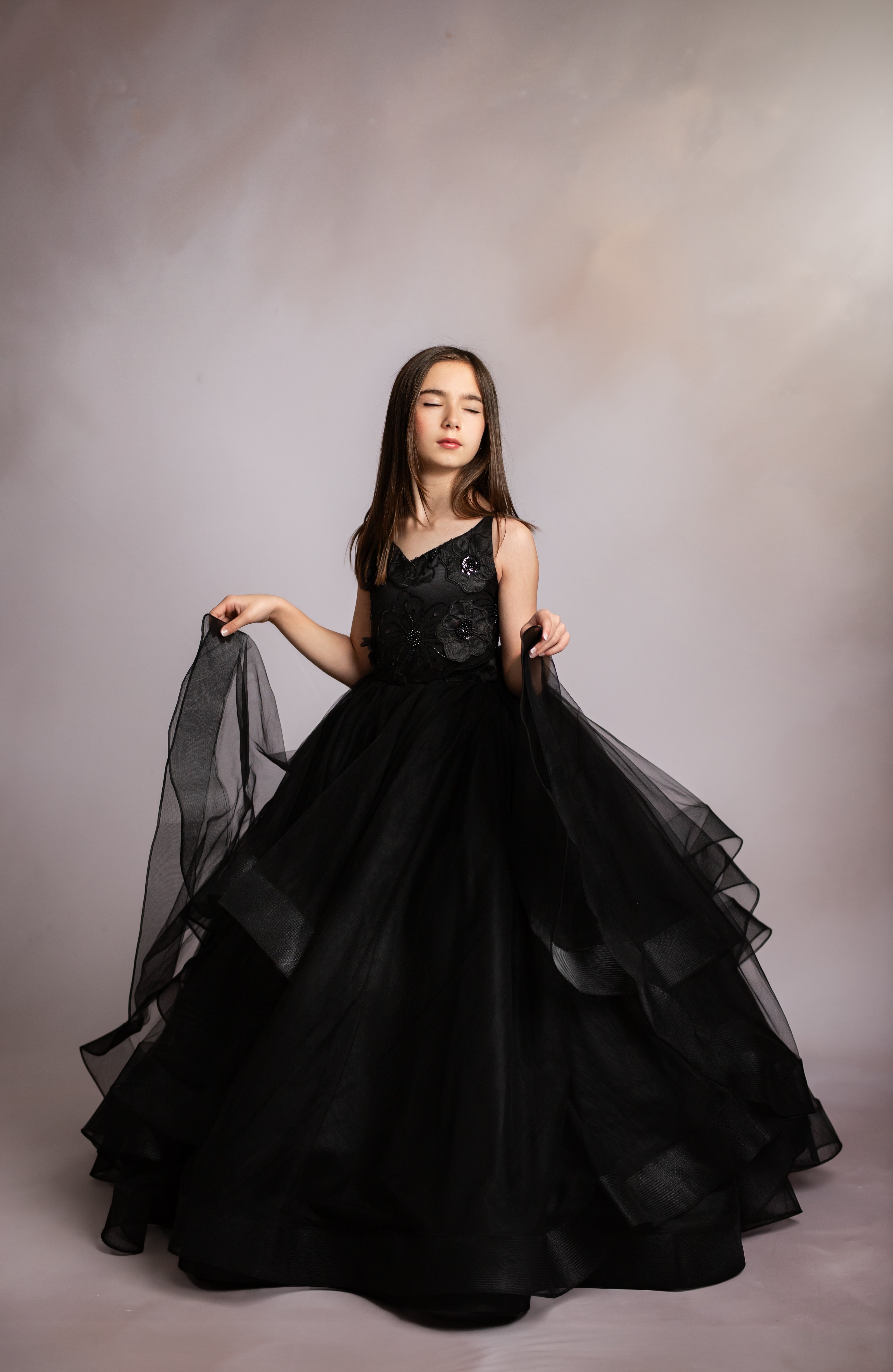 "Young girl twirling in the Seraphina Grace gown, ideal for birthday and milestone photos"