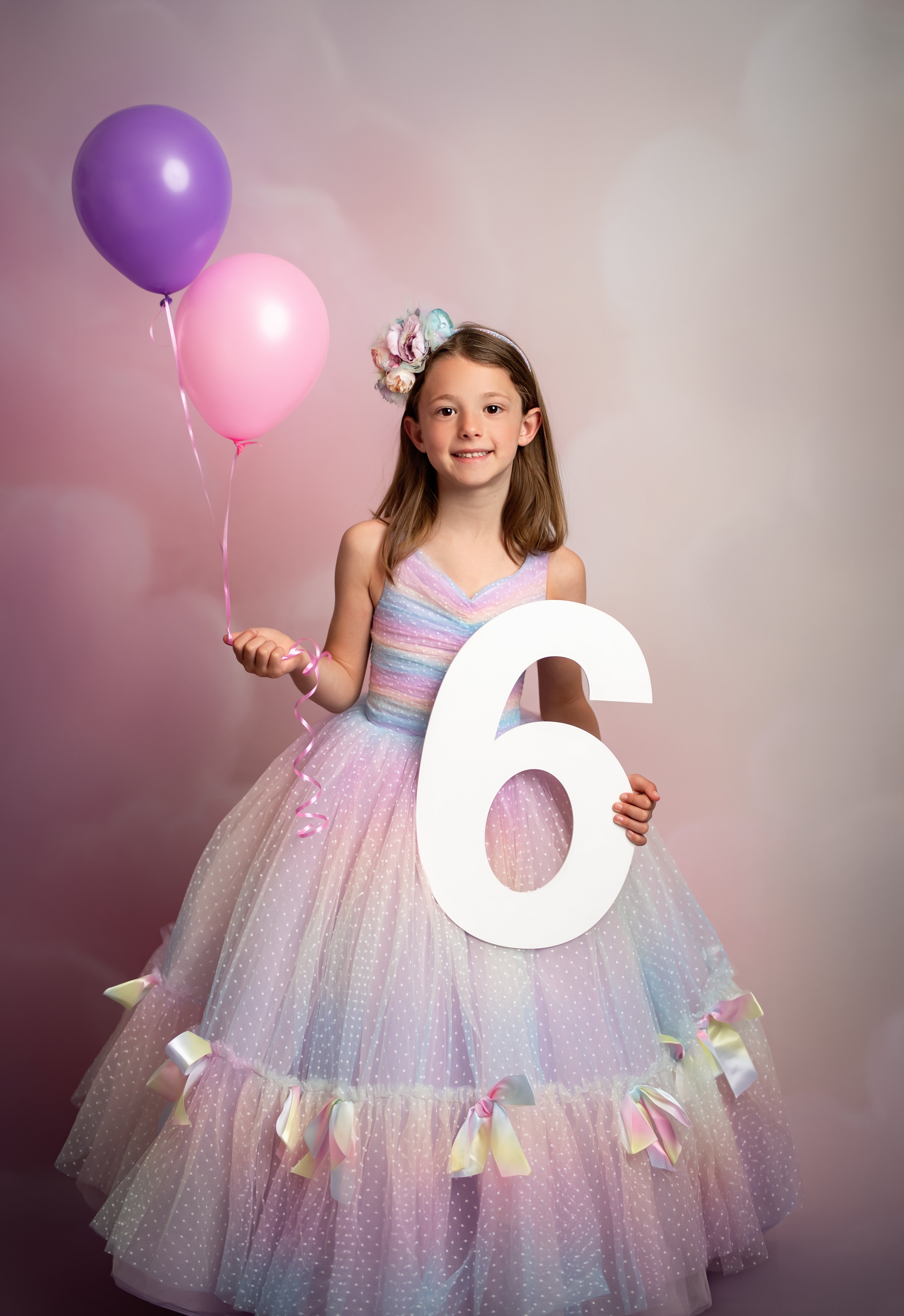 "Model wearing Addison Couture Gown in a styled garden shoot, showcasing elegance and charm"