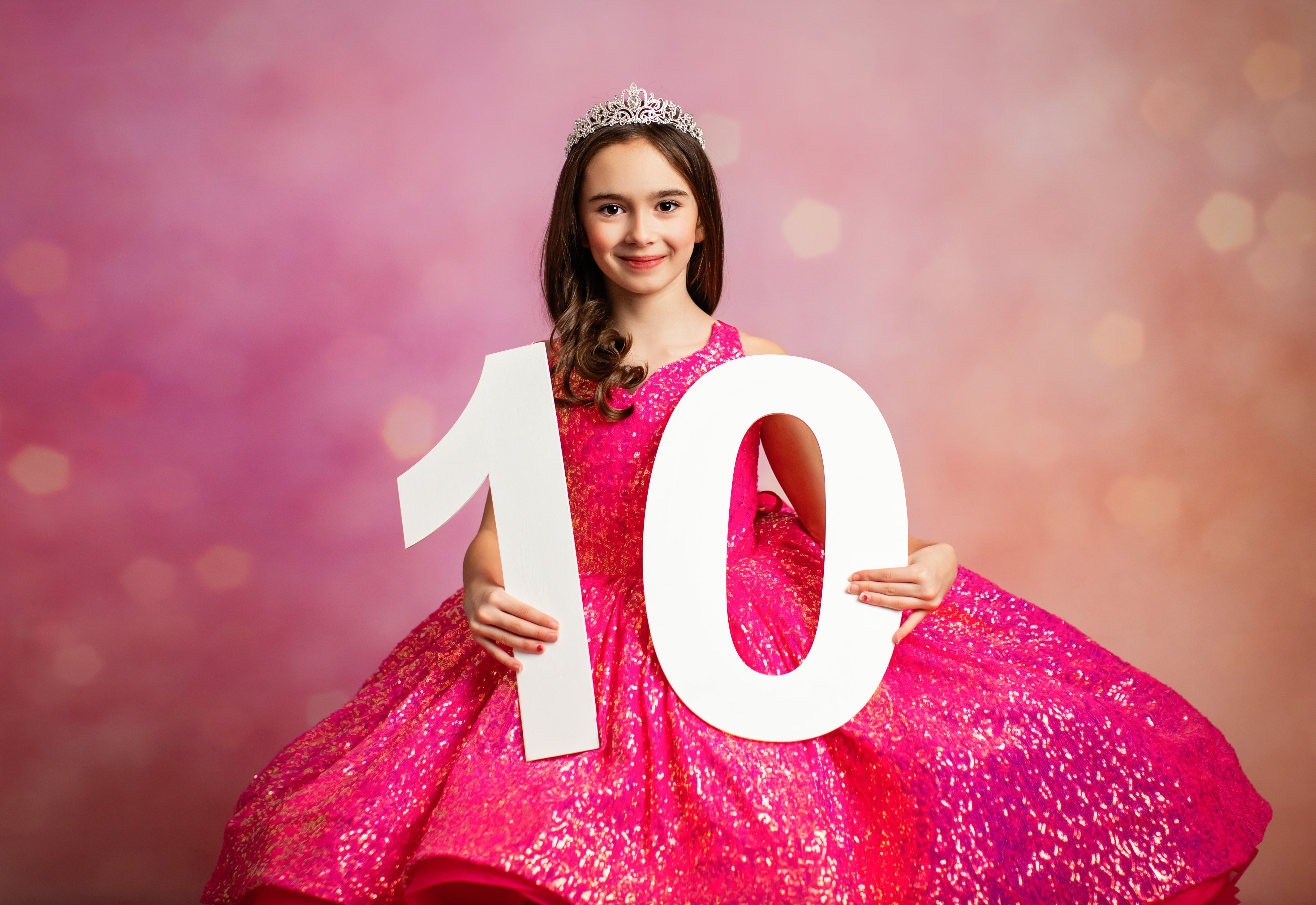 Twirling in pink sequin gown for photoshoot