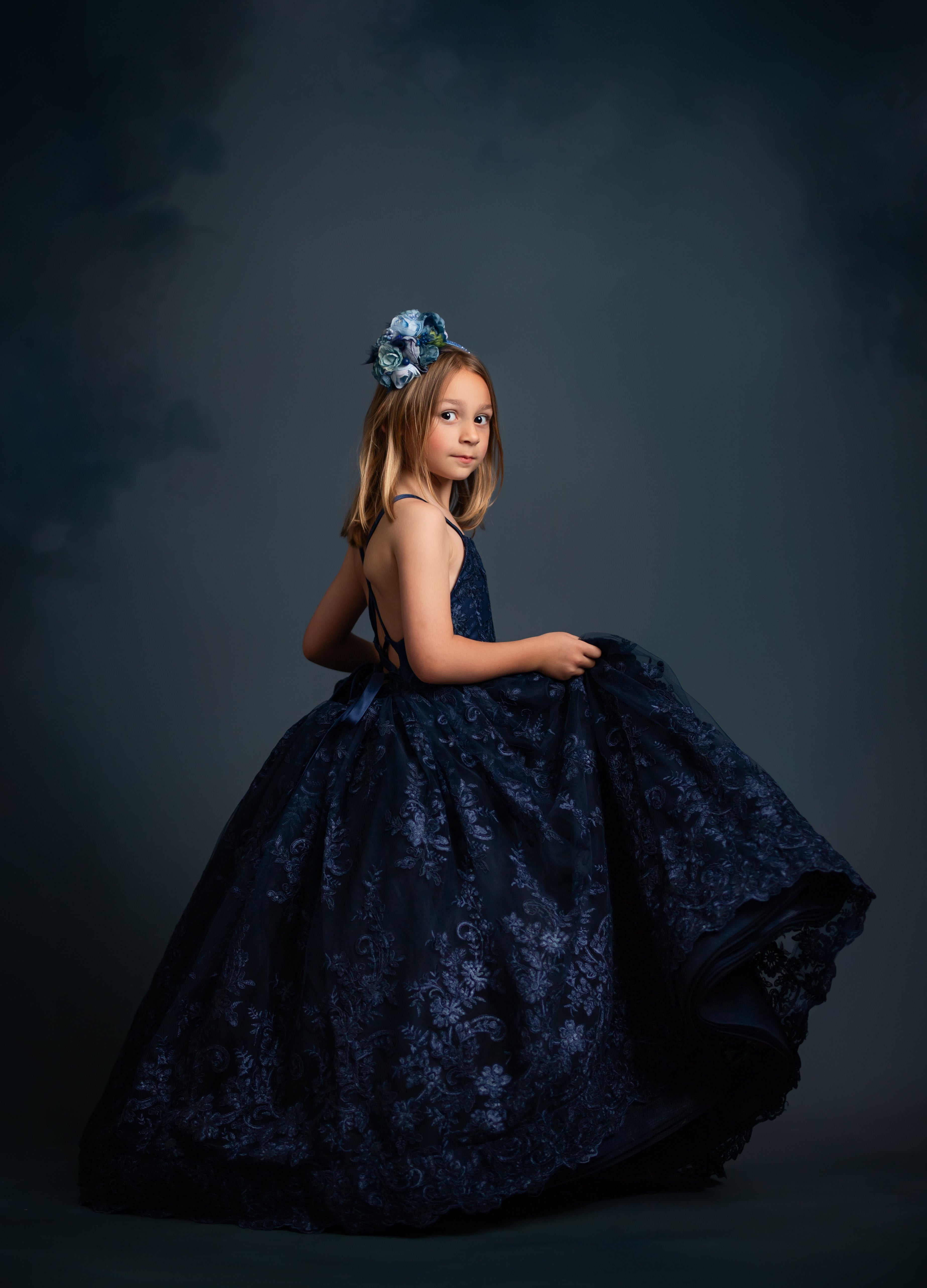 "Custom floor-length gown with voluminous layers of bridal tulle and adjustable straps"