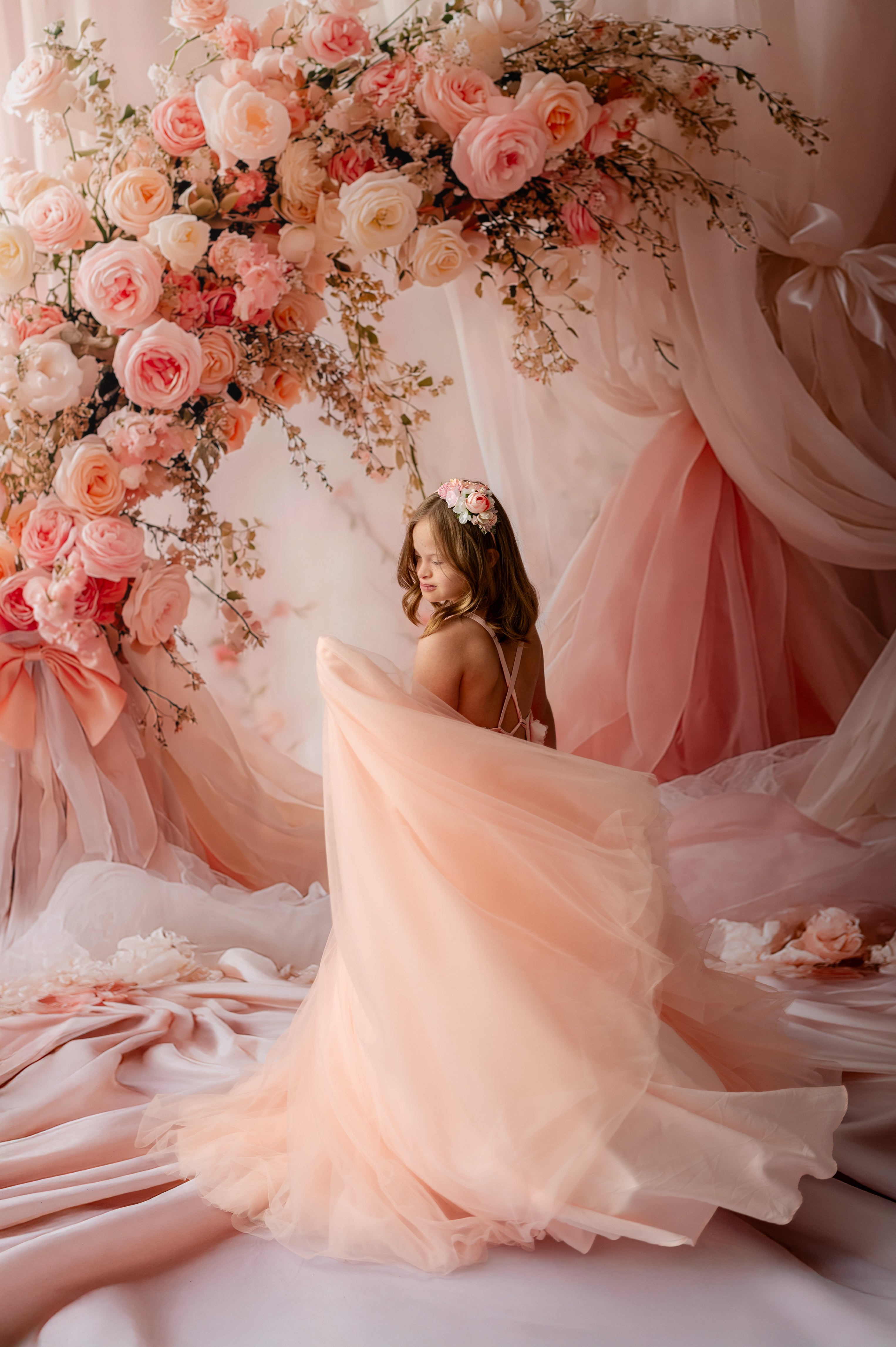 "Children’s floor-length peach tulle dress with floral details for portraits"