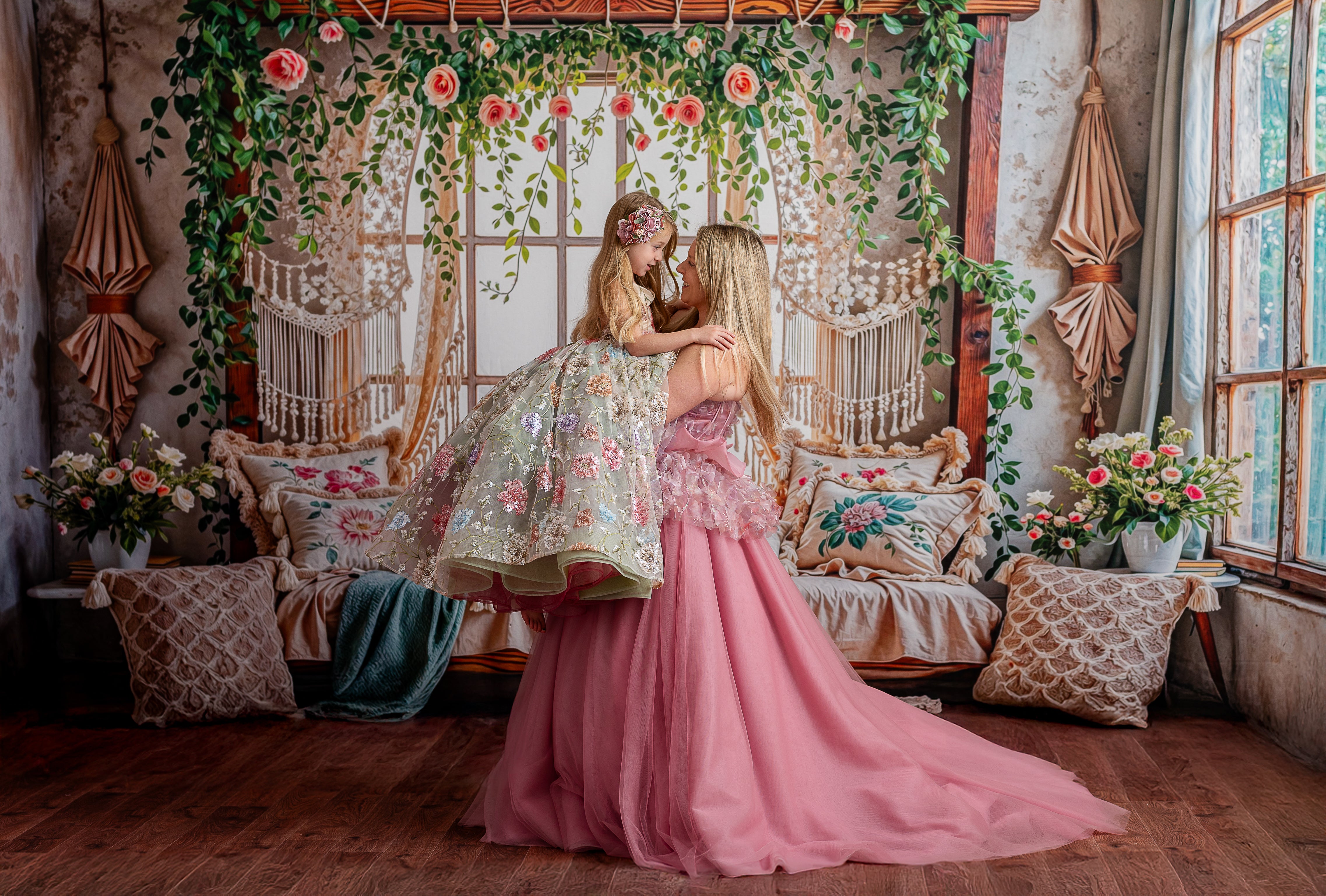 Romantic blush maternity-friendly gown with a structured bodice and soft, ethereal fabric, ideal for elegant photography sessions.